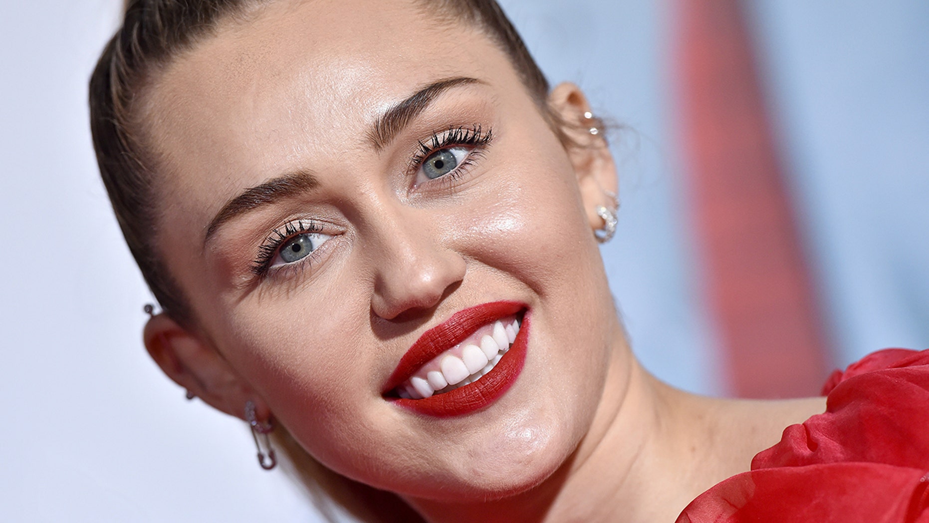 Miley Cyrus attends the premiere of Warner Bros