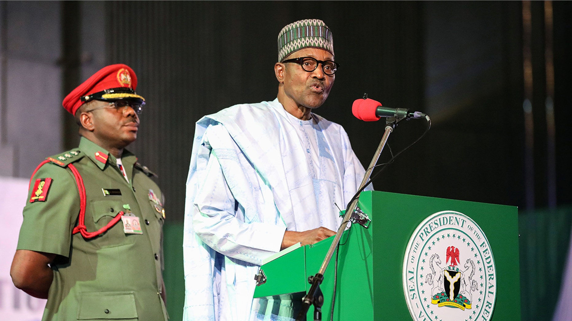 Nigerian President Muhammadu Buhari addresses the audience following his re-election, after Nigeria's Independent National Electoral Commission presented his certificate of election on February 27, 2019, in Abuja. (KOLA SULAIMON/AFP/Getty Images)