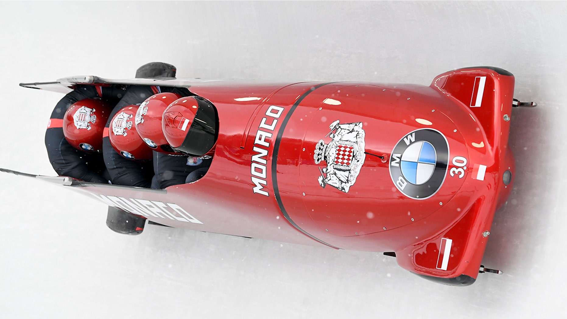 Driver Rudy Rinaldi, Boris Vain, Thibault Demarthon, and brakeman Mendonnaca Steven Borges of Monaco round a turn in the first run of the four-man Bobsled World Cup event, Saturday, Feb. 16, 2019, in Lake Placid, N.Y.