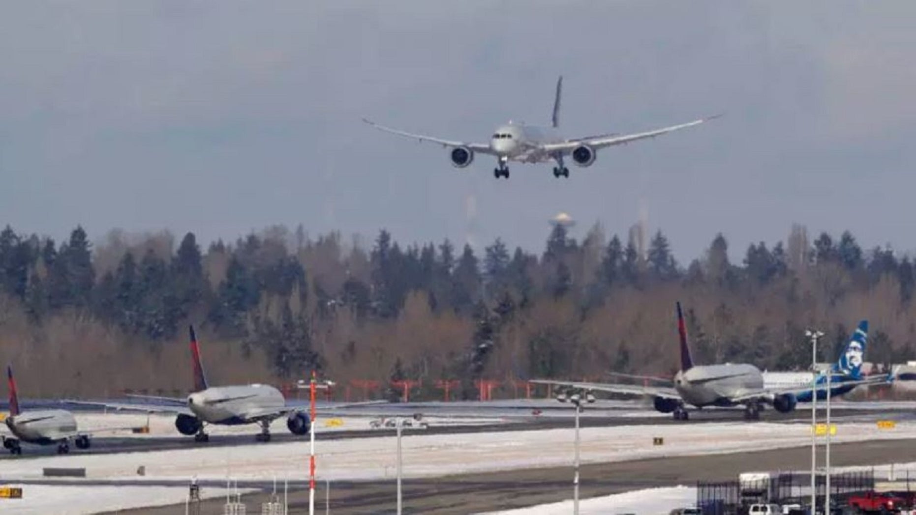 February 5: A Virgin Atlantic flight arrives for a landing over another ground aircraft on Tuesday, February 5, 2019, at the Seattle-Tacoma International Airport in Seattle. (AP Photo / Ted S. Warren)