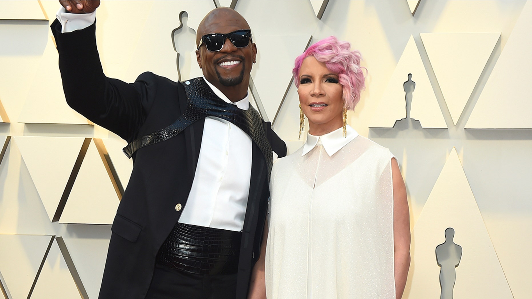Terry Crews, left, and Rebecca King-Crews arrive at the Oscars on Sunday, Feb. 24, 2019, at the Dolby Theatre in Los Angeles.