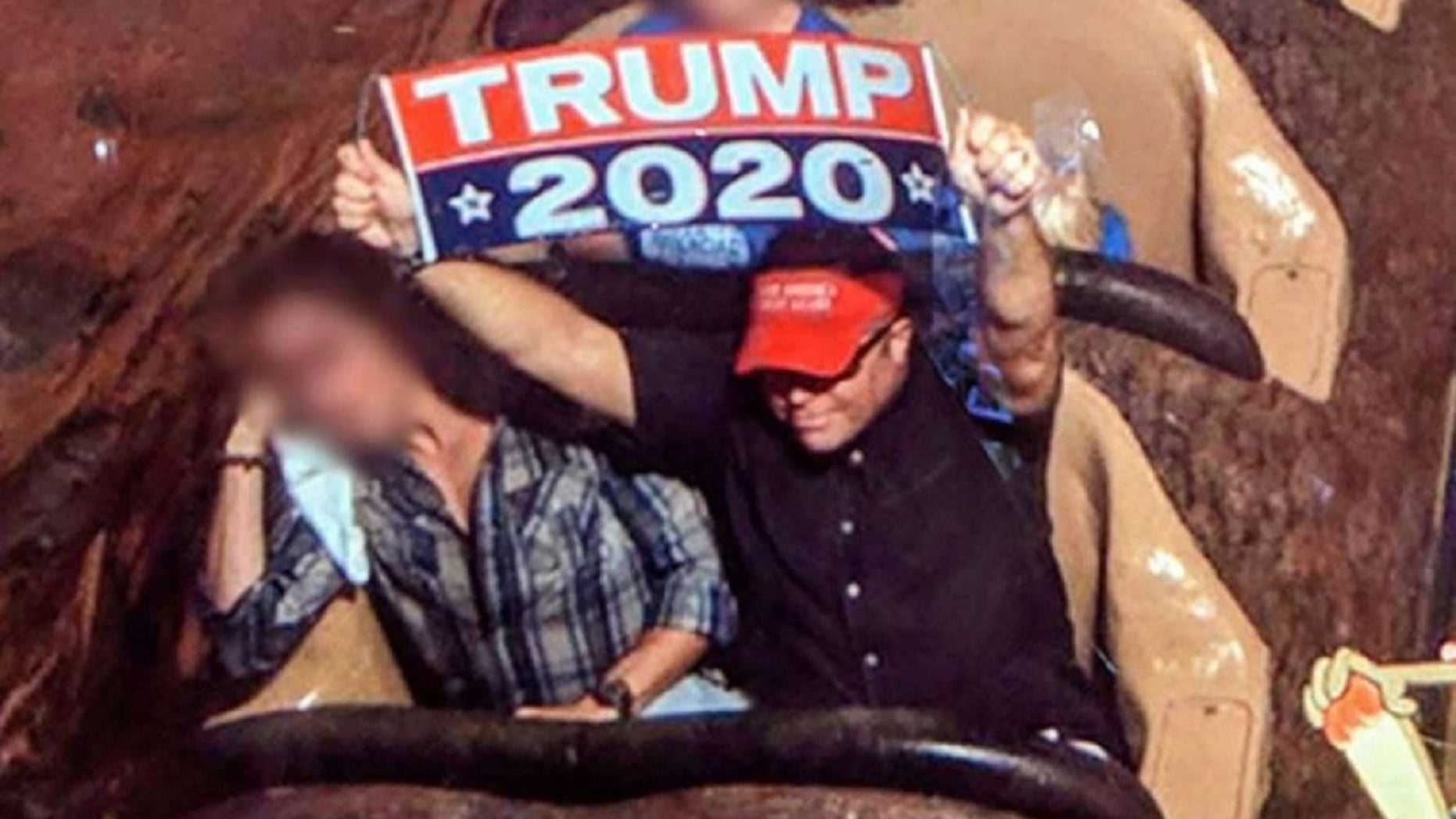 Dion Cini was ejected from Disneyland for unfurling a large "Trump2020" banner at the park.