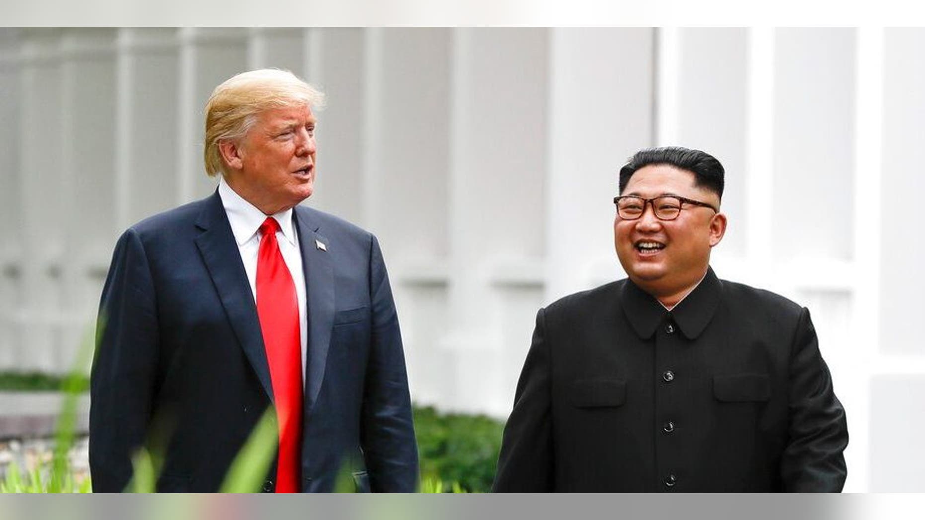FILE - In this June 12, 2018, file photo, President Donald Trump, left, and North Korea leader Kim Jong Un walk from their lunch at the Capella resort on Sentosa Island in Singapore. (AP Photo/Evan Vucci, File)