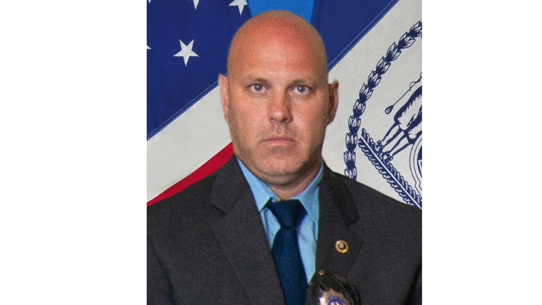 In this undated photo provided by the New York City Police Department, Det. Brian Simonsen is shown. New York Police Commissioner James O'Neill told the media at a news conference that Simonsen was shot dead by a friendly fire on Tuesday night, February 12, 2019, while he was responding to a robbery report at a T-Mobile store in the Richmond Hill section of Queens. (New York City Police Department via AP)