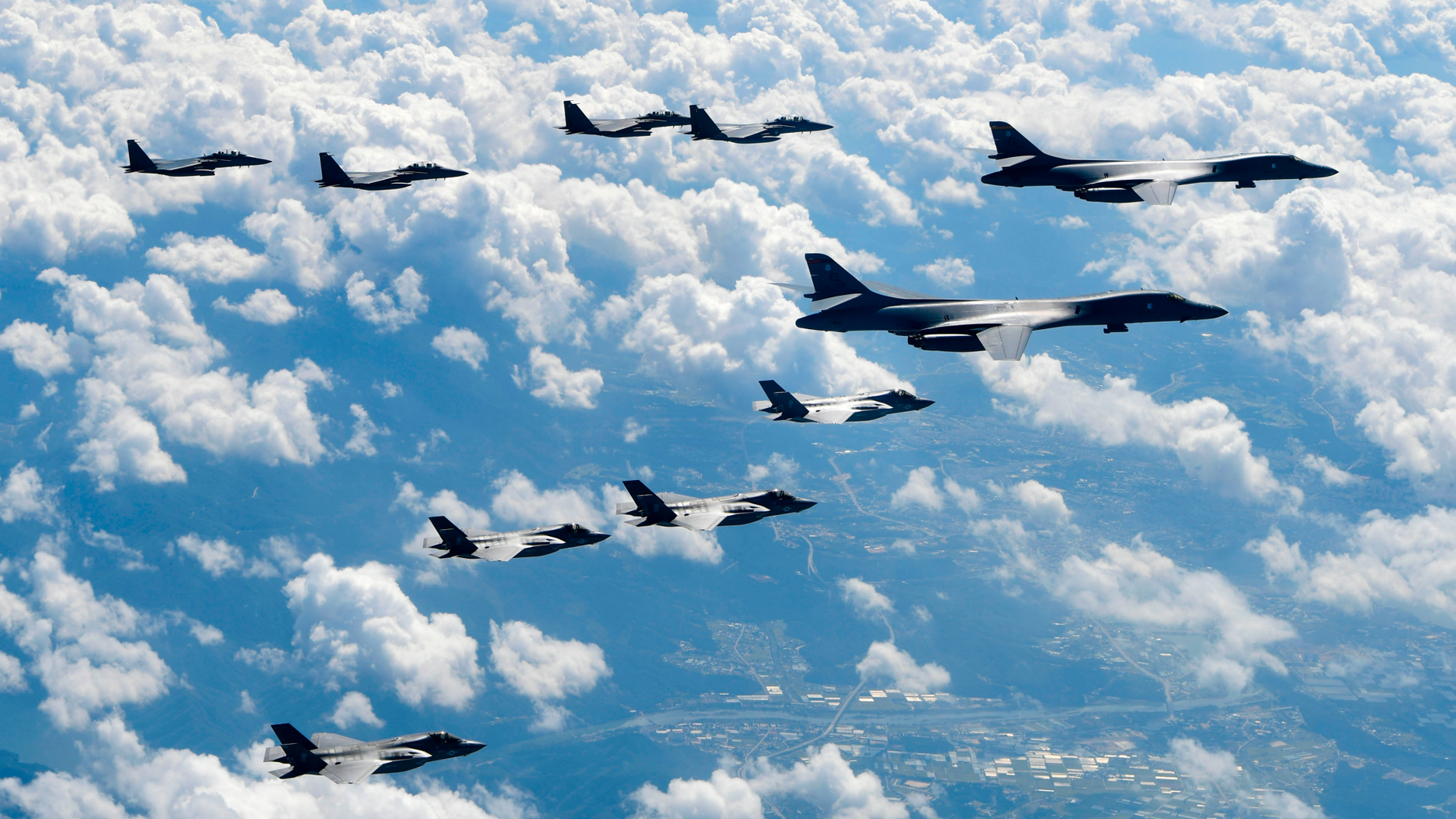 FILE - In this Sept. 18, 2017, file photo provided by South Korea Defense Ministry, U.S. Air Force B-1B bombers, F-35B stealth fighter jets and South Korean F-15K fighter jets fly over the Korean Peninsula during joint drills. Ahead of the second summit between U.S. President Donald Trump and North Korean leader Kim Jong Un, some observers say there is an uncertainty over the future of the decades-long military alliance between Washington and Seoul. (South Korea Defense Ministry via AP, File)