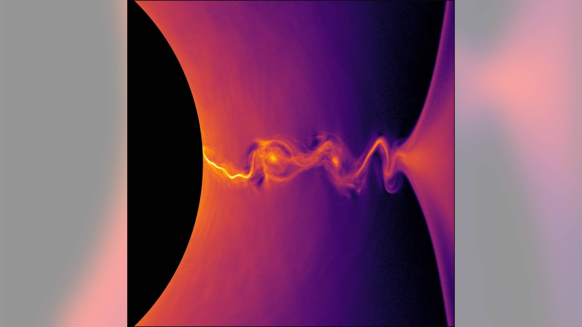 A new computer model captures the twisting lines of plasma jets that stream out from the edges of a black hole. Here, a simulation of so-called collisionless relativistic plasma shows the density of positrons, or antimatter partners to electrons, near a rotating black hole.