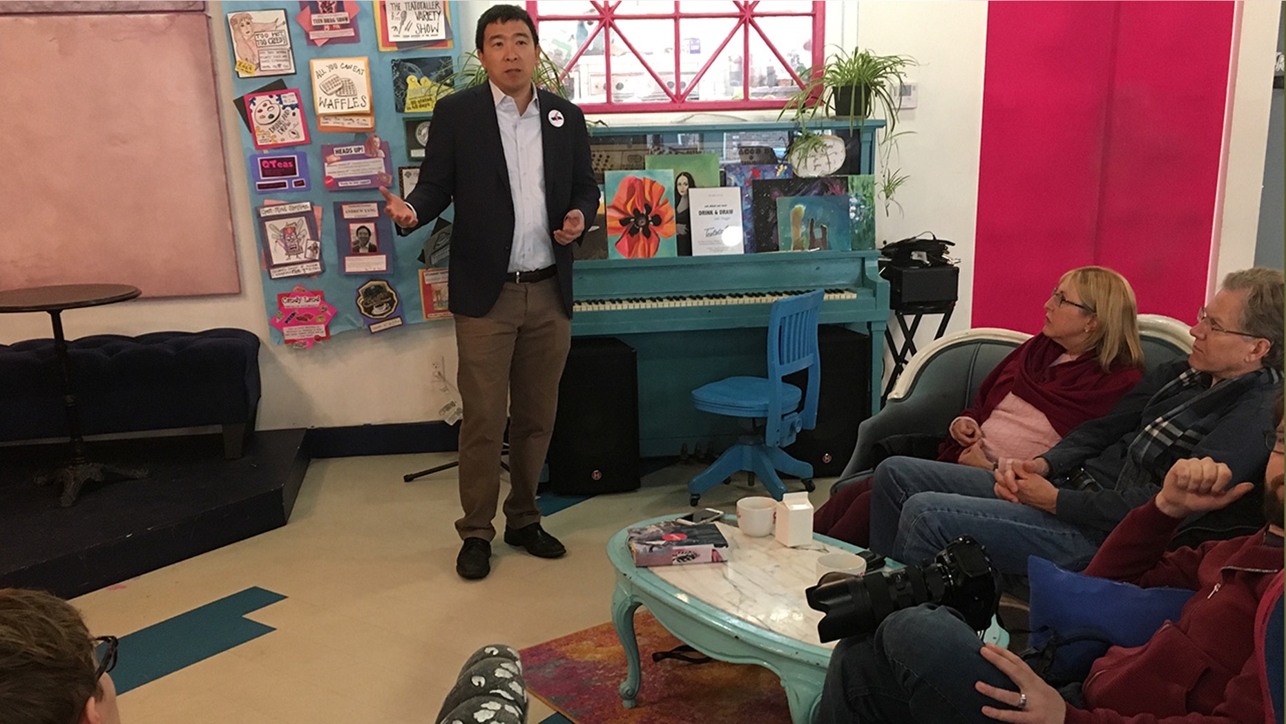 Andrew Yang talks to voters at a café in Somersworth, New Hampshire.