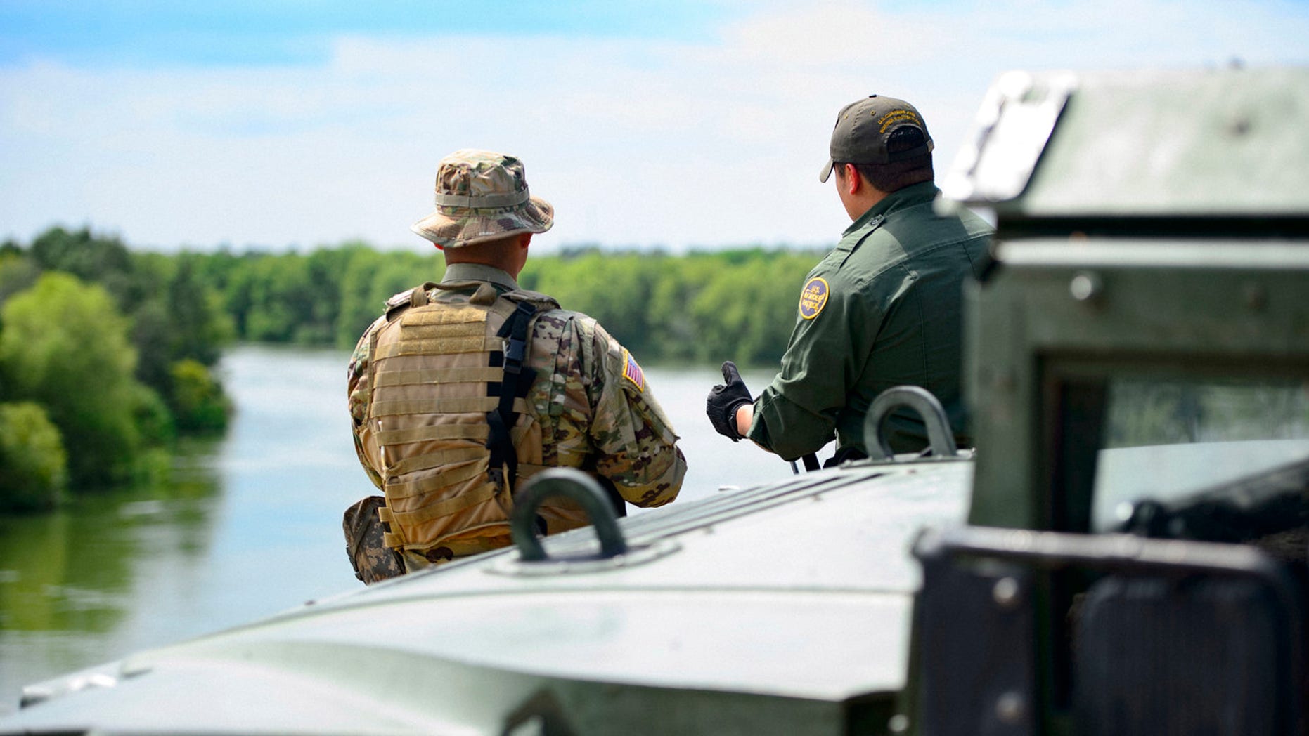   FILE: A Texas guard and a customs officer and Border Patrol in Texas. Border Patrol 