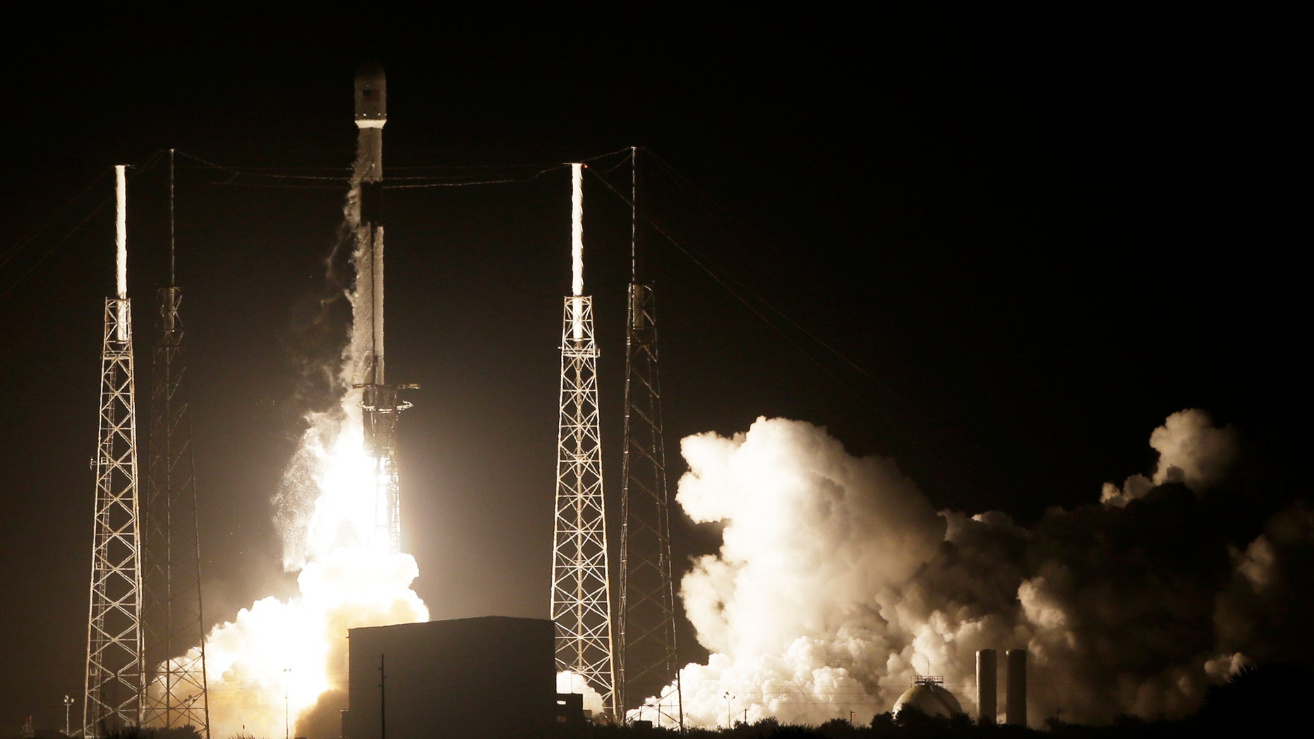 A SpaceX Falcon 9 rocket lifts off with Israel's Lunar Lander and an Indonesian communications satellite at space launch complex 40, Thursday, Feb. 21, 2019, in Cape Canaveral, Fla. An Israeli spacecraft blasted off to the moon in an attempt to make the country’s first lunar landing, following a launch Thursday night by SpaceX. (AP Photo/Terry Renna)