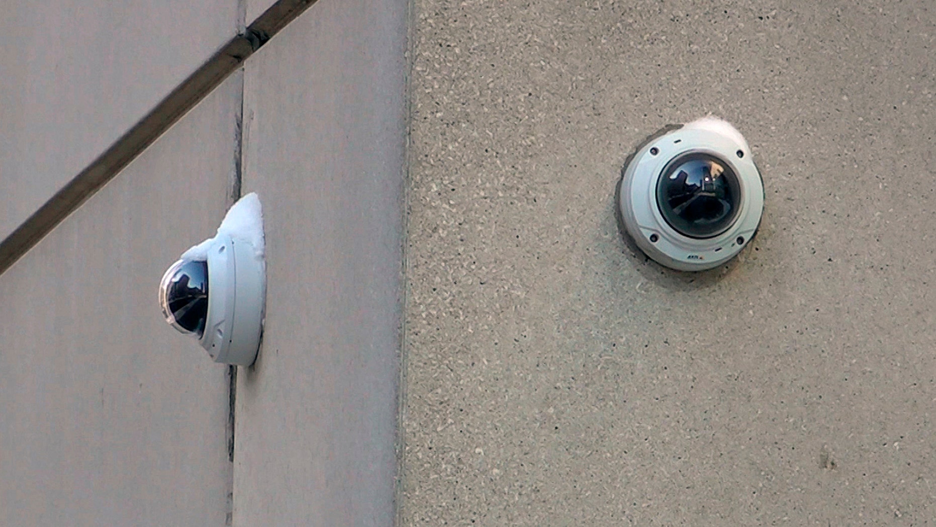 In this Feb. 1, 2019 photo, surveillance cameras are seen near the spot where "Empire" actor Jussie Smollett allegedly staged the attack in Chicago. Chicago police tapped into a vast network of surveillance cameras _ and some homeowners' doorbell cameras _ to help determine the identities of two brothers who later claimed they were paid by "Empire" actor Jussie Smollett to stage a racist and homophobic attack. (AP Photo/Teresa Crawford)