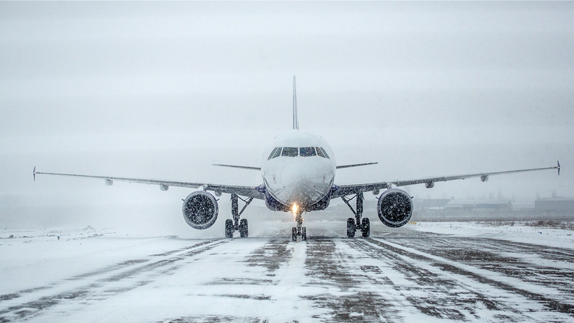 A small airplane in Indiana slid off the snowy runway, across a field and into the highway.
