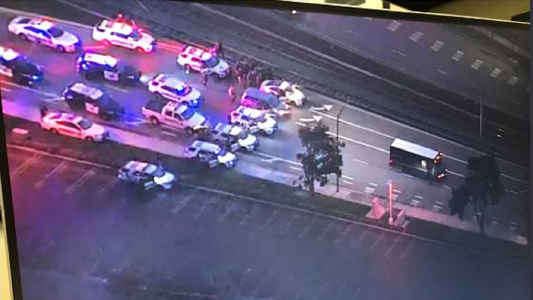 Two suspects allegedly stole a UPS truck and held the driver hostage during an attempt to flee the authorities on Thursday afternoon, officials said.