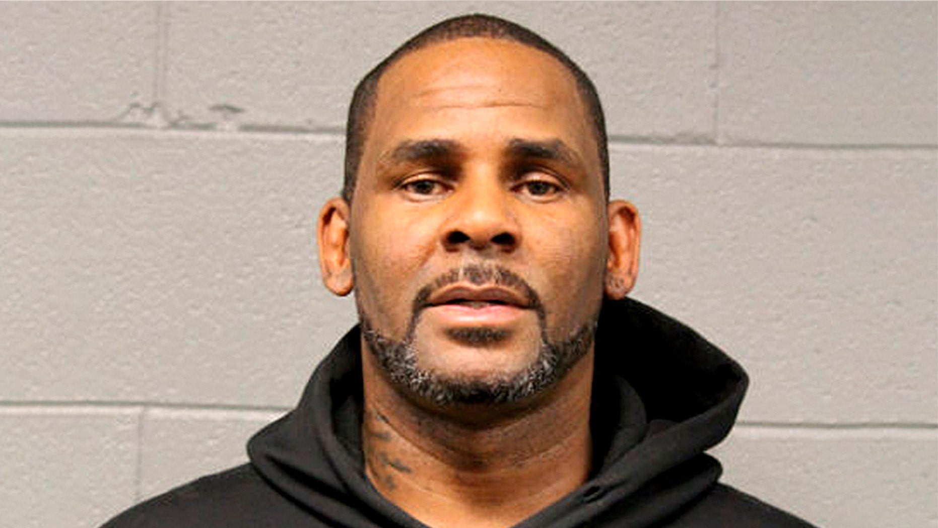 In this photo taken and released by the Chicago Police Dept., Friday, Feb. 22, 2019, singer R. Kelly is photographed during booking at a police station in Chicago, Il.