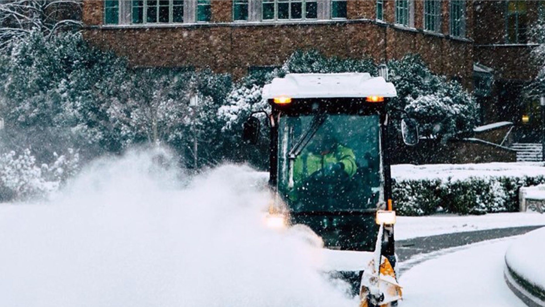 A plow is seen on the University of Washington campus after a snow storm.