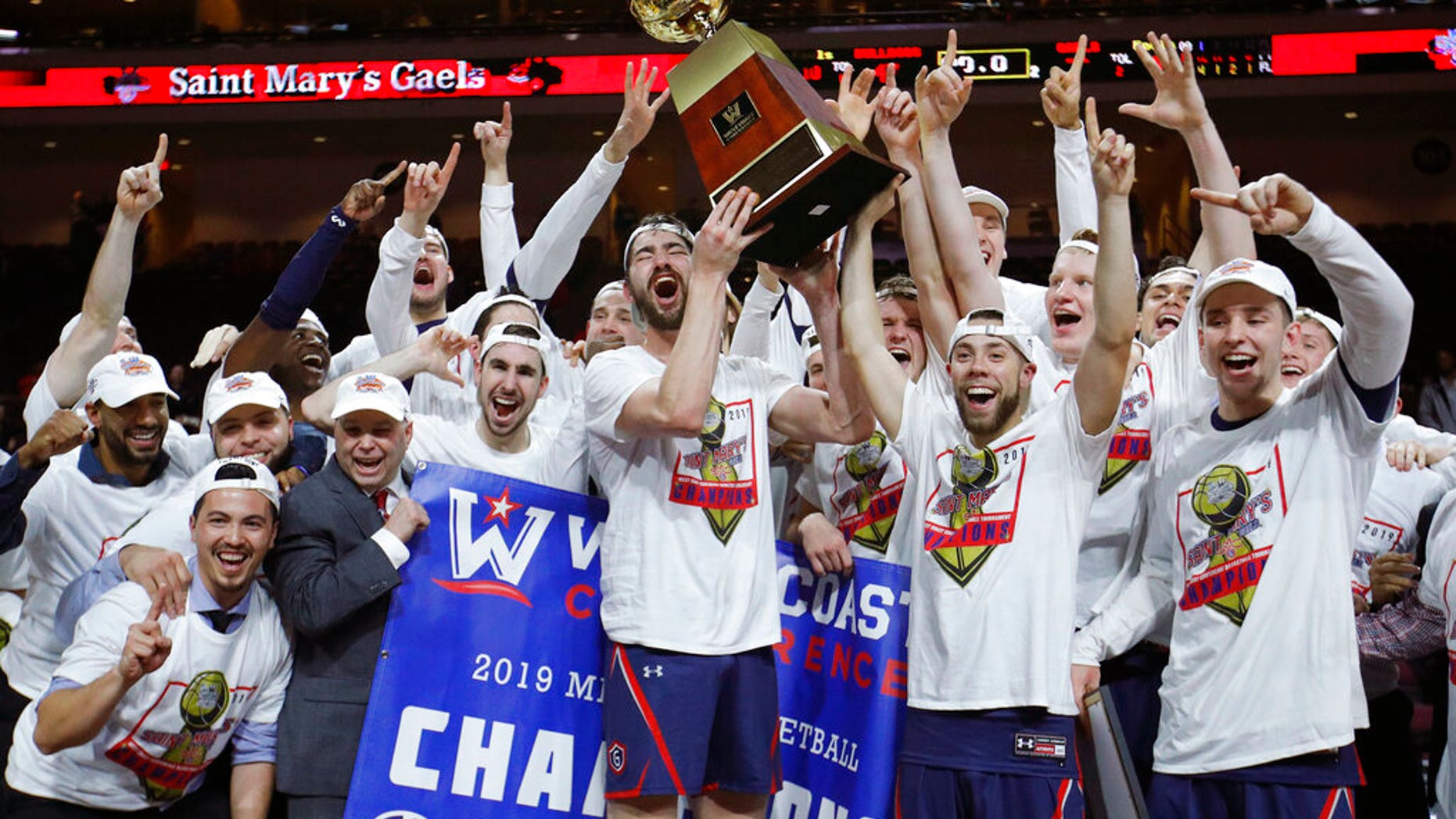 St. Mary's celebrates after defeating Gonzaga 60-47 in an NCAA college basketball game for the West Coast Conference men's tournament title.