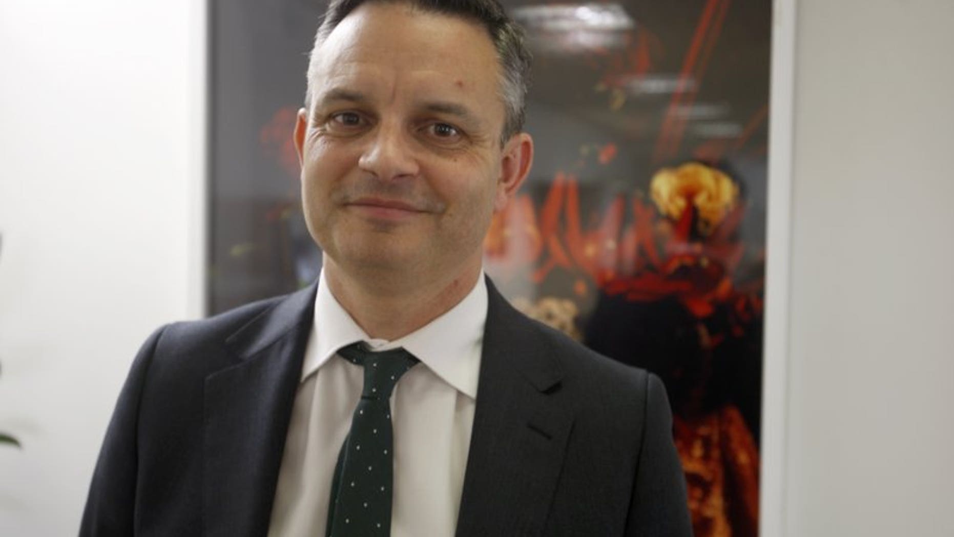 In this Dec. 4, 2018, file photo, New Zealand's Climate Change Minister James Shaw poses in Wellington, New Zealand. Shaw, also co-leader of the Green Party, was walking past Wellington's Botanic Garden just before 8 a.m. Thursday, March 14, 2019, when a man started talking to him before grabbing him and punching him several times.