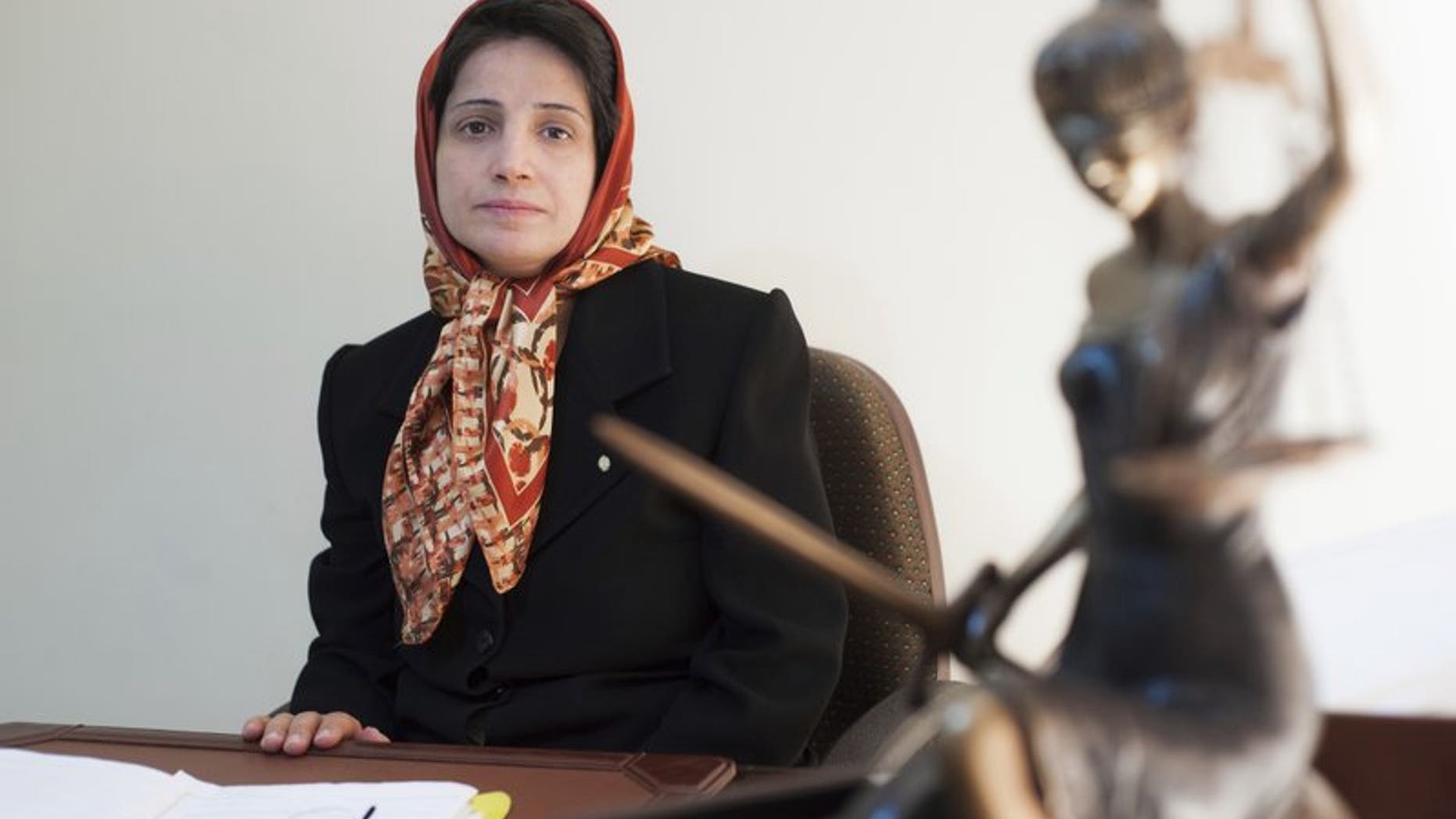 In this Nov. 1, 2008 photo, Iranian human rights lawyer Nasrin Sotoudeh, poses for a photograph in her office in Tehran, Iran. On Wednesday, March 6, 2019, the New York-based Center for Human Rights in Iran, said Sotoudeh, a prominent human rights lawyer in Iran who defended women protesting against the Islamic Republic's mandatory headscarf, has been convicted and faces years in prison.