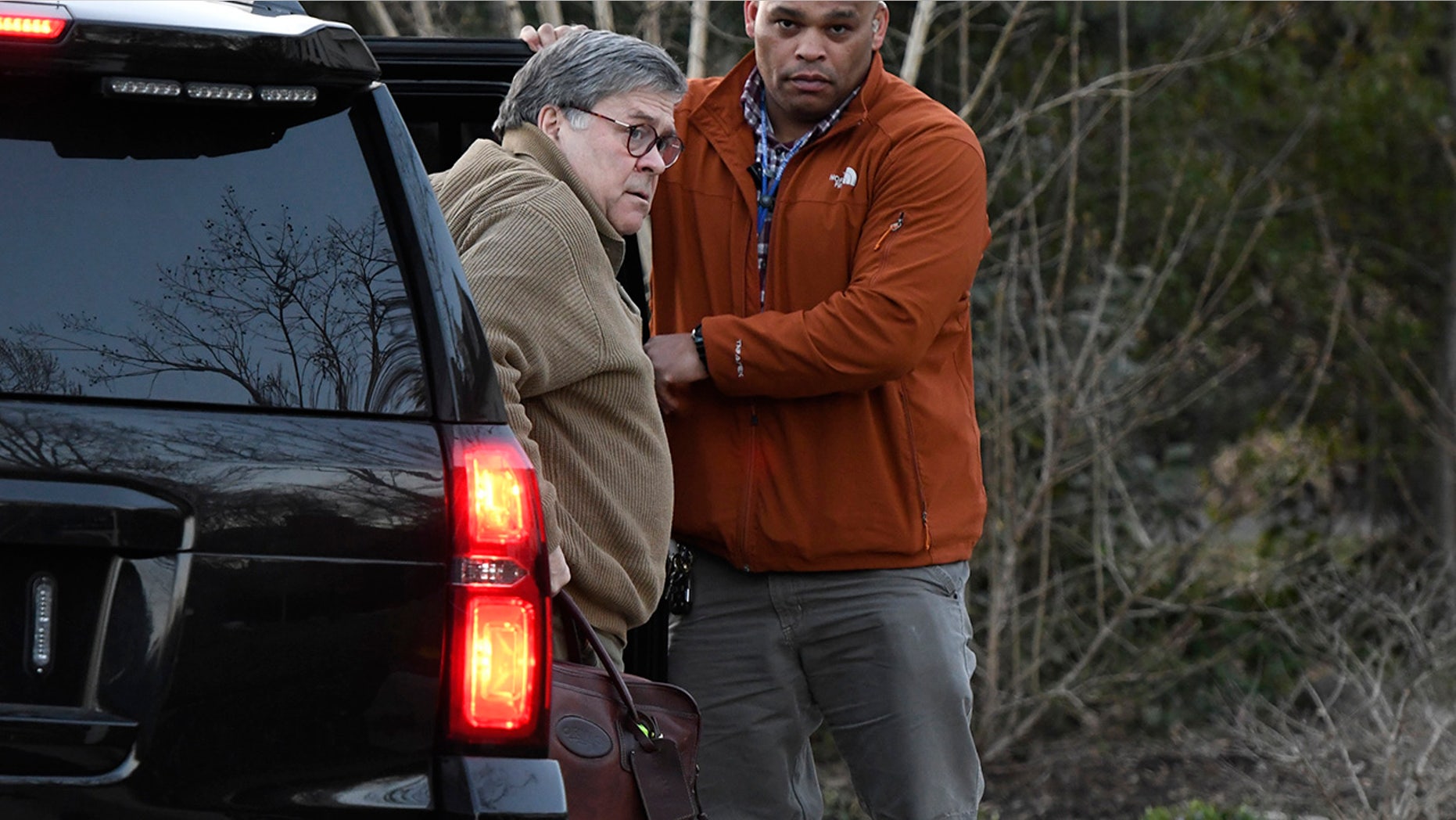 U.S. Attorney General William Barr, left, arrives at his home in McLean, Va., on Saturday evening, March 23, 2019. Barr will decide how much of Special Counsel Robert Mueller's Russia investigation report will be released to Congress and the public. (Associated Press)