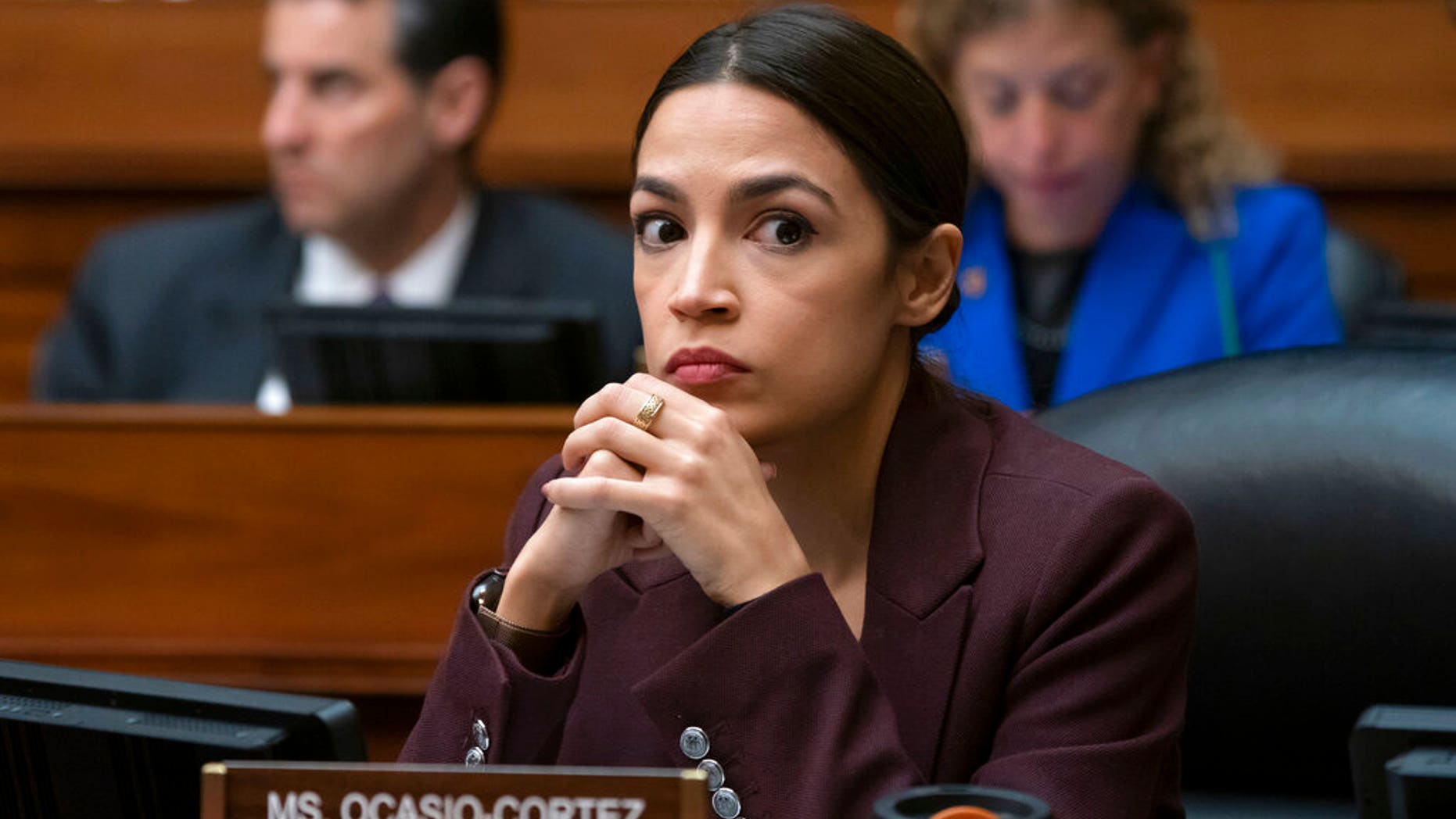 Rep. Alexandria Ocasio-Cortez, D-N.Y., listens to questioning of Michael Cohen, President Donald Trump's former personal lawyer, at the House Oversight and Reform Committee. (Associated Press)