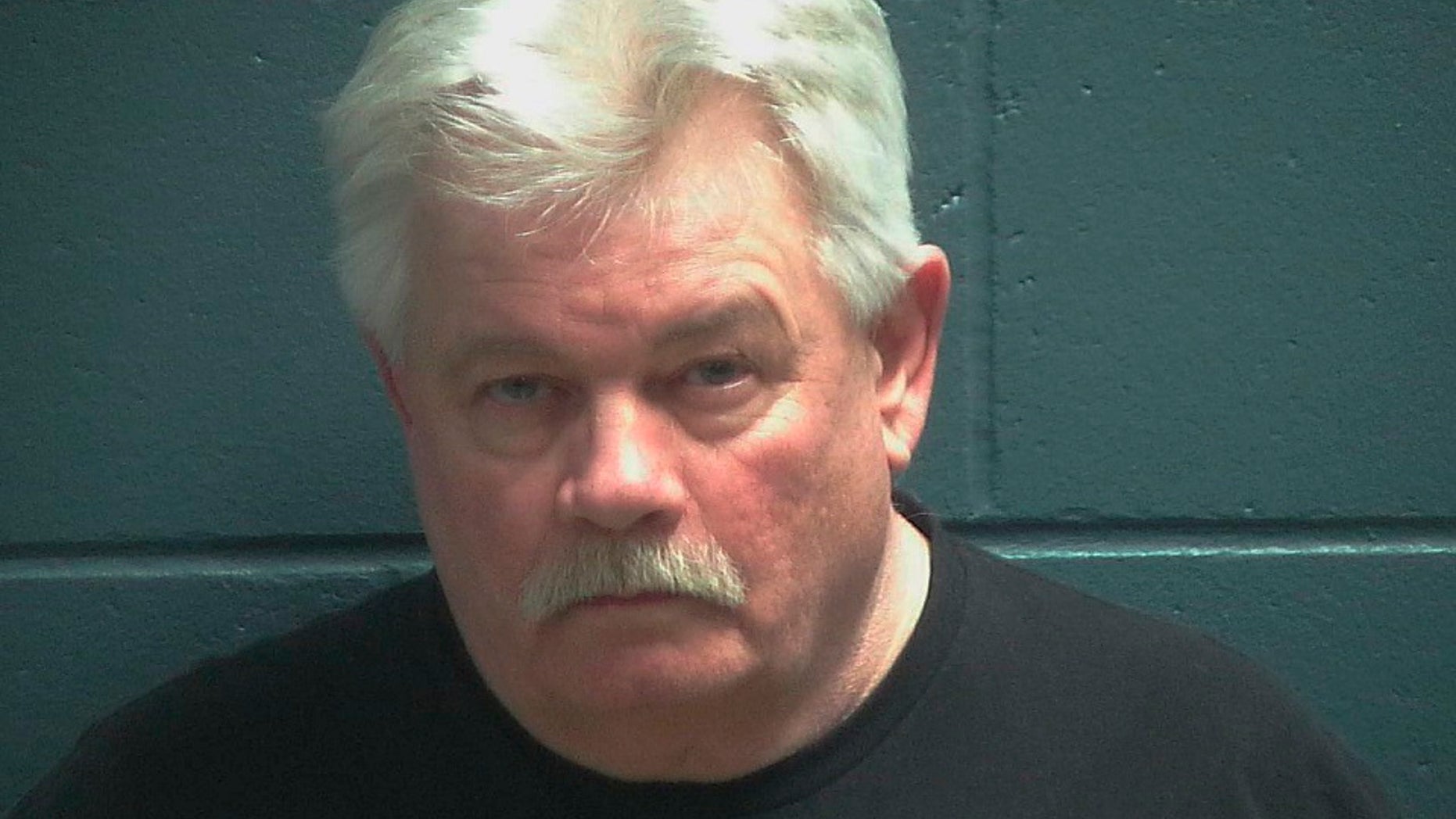 Douglas Kluth is facing at least his 10th drunken driving charge. Authorities allege he had an open beer on the center console of his car. (Oconto County Jail via AP)