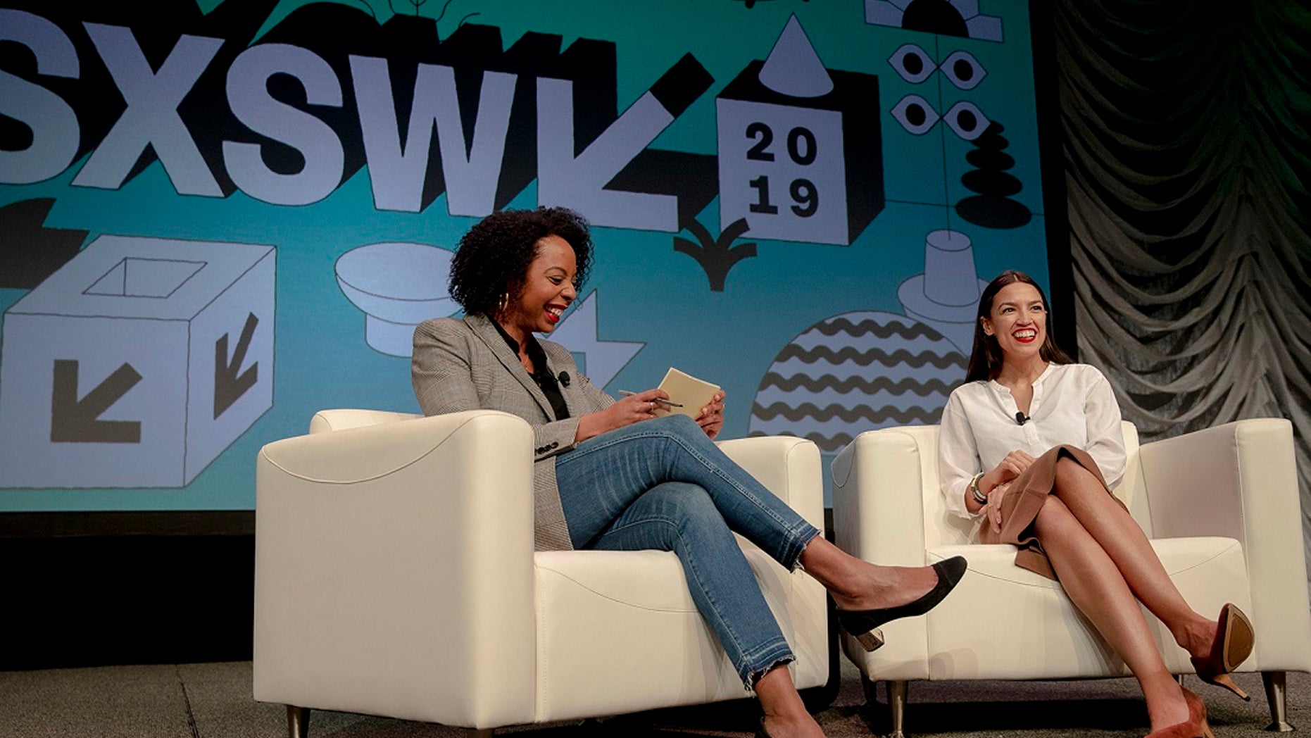 Rep. Alexandria Ocasio-Cortez, right, D-New York, speaks with Briahna Gray, a senior politics editor at The Intercept, during South by Southwest on Saturday, March 9, 2019, in Austin, Texas. (Nick Wagner/Austin American-Statesman via AP)