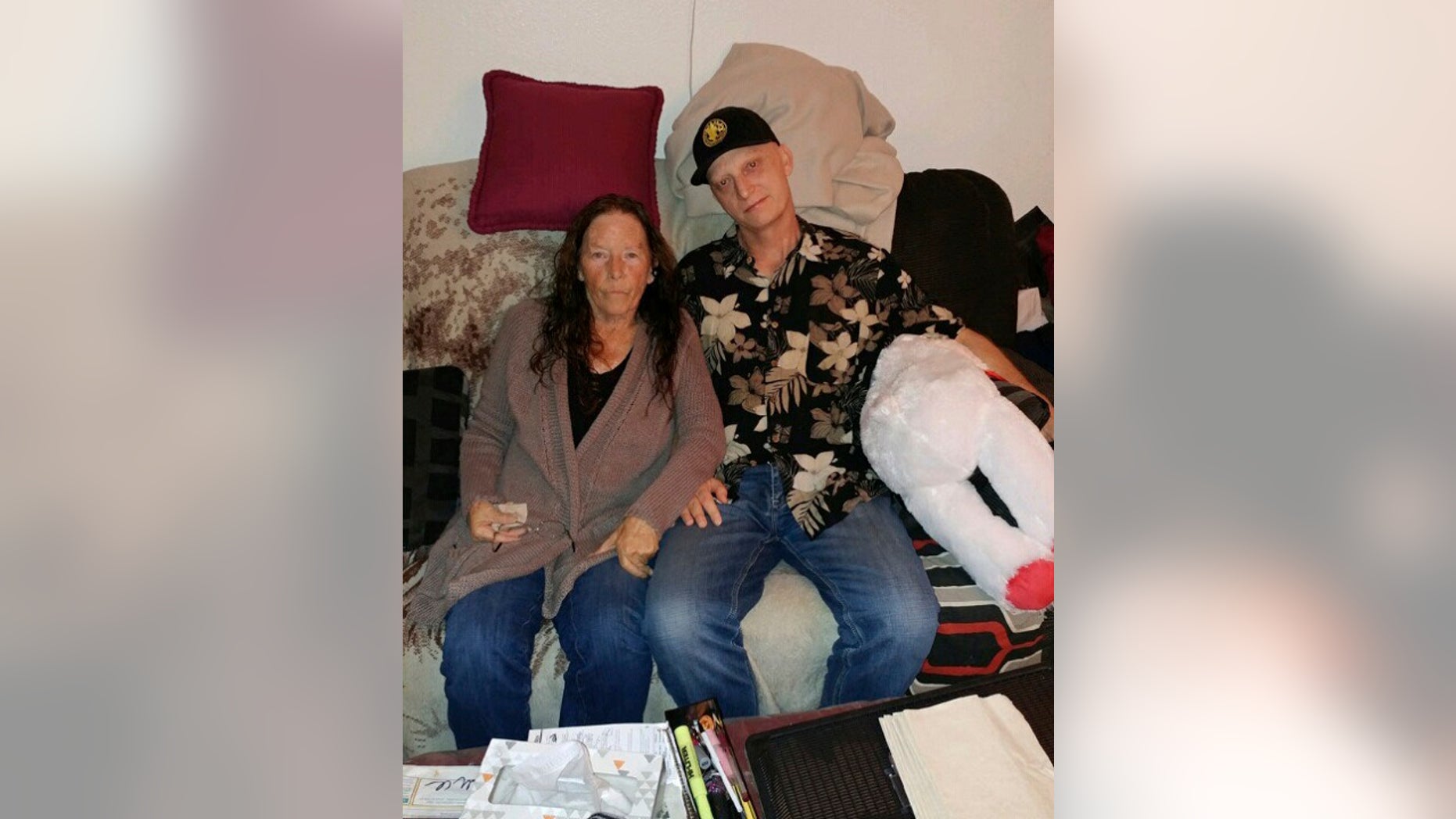 Michael R. White, right, is seen with his mother, Joanne White, in 2018. White, a U.S. Navy veteran from California, has been sentenced to 10 years in prison in Iran, his lawyer said Saturday, March 16, 2019. (White family via Associated Press)