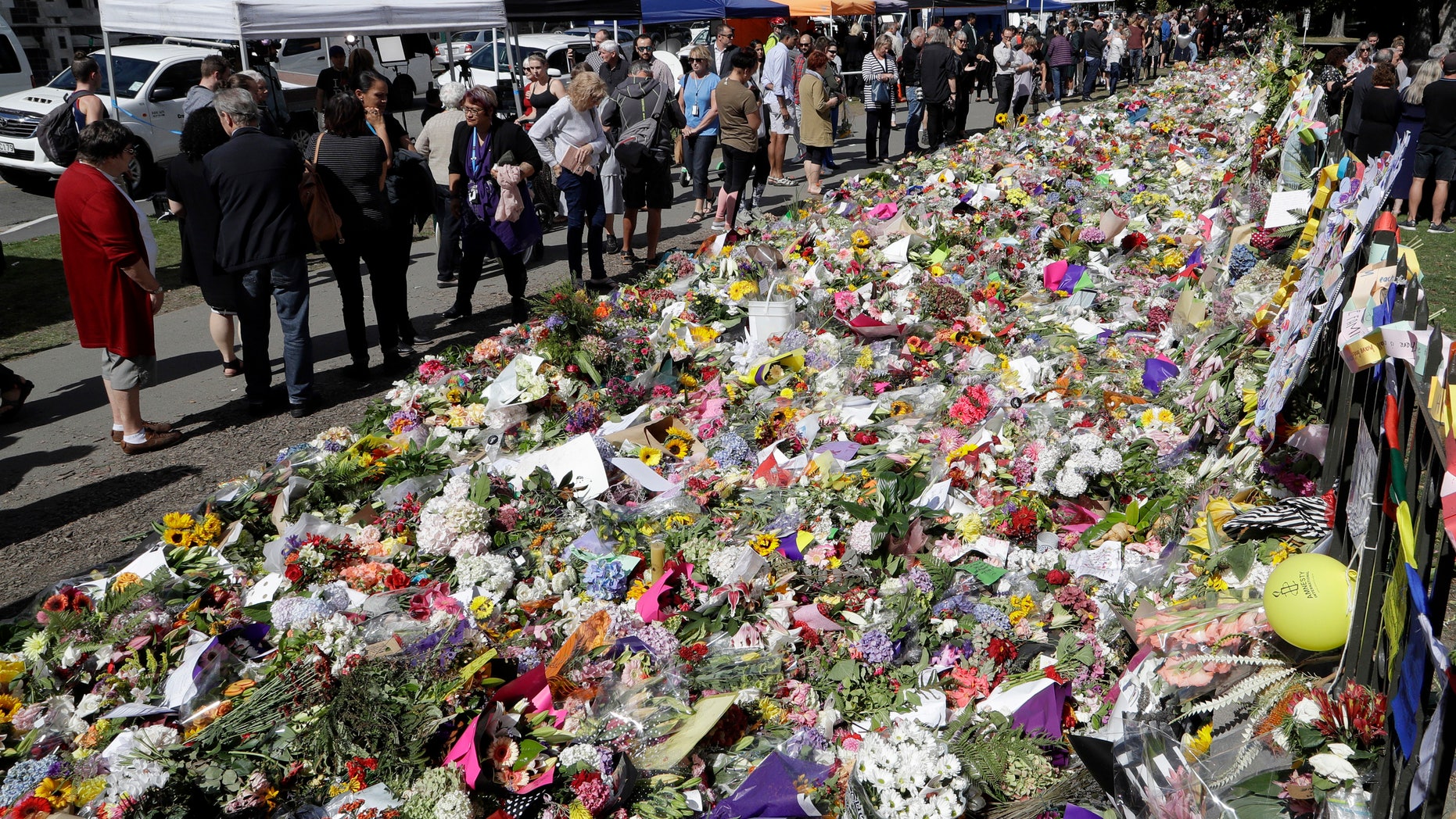 A man who once visited the rifle club where the New Zealand mass shooting suspect attended says he warned police about the shocking and extremist views of members there years ago, but nothing was done. Pictured is a memorial to the victims of Friday's shooting in Christchurch