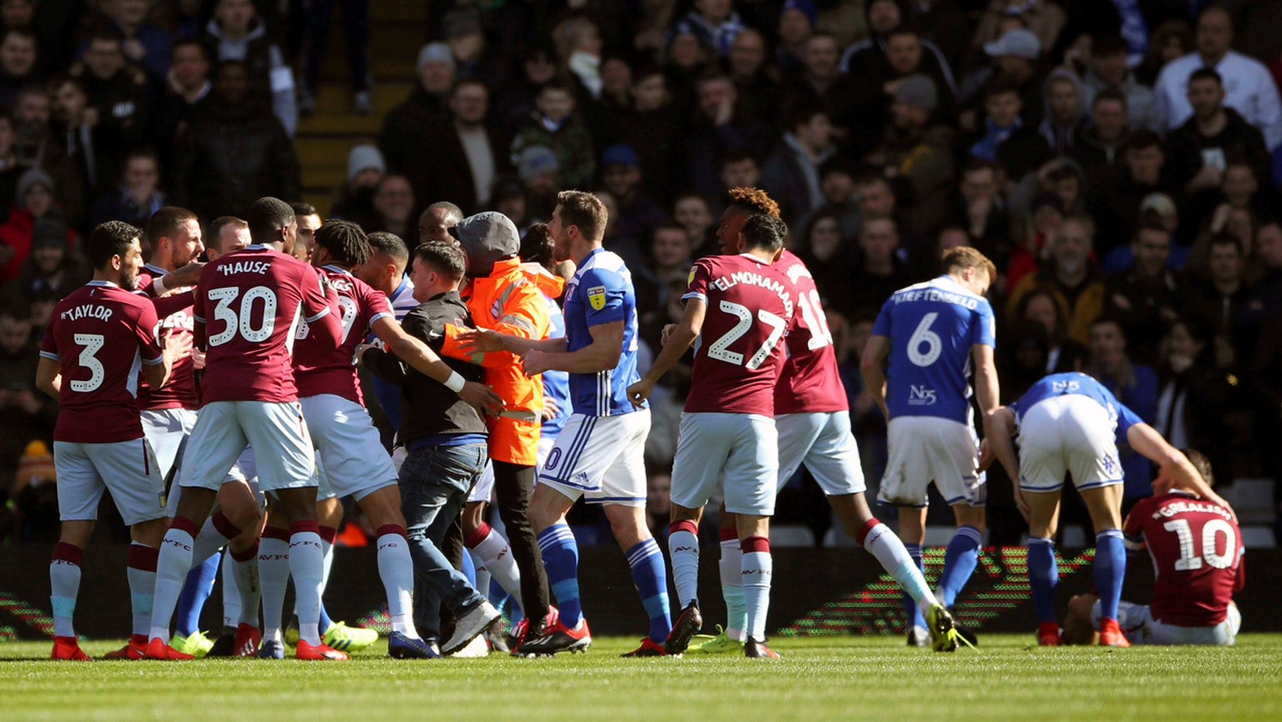 A fan was removed after attacking Aston Villa's Jack Grealish right on the pitch during the Sky Bet Championship soccer match at St Andrew's Trillion Trophy Stadium Birmingham England on Sunday