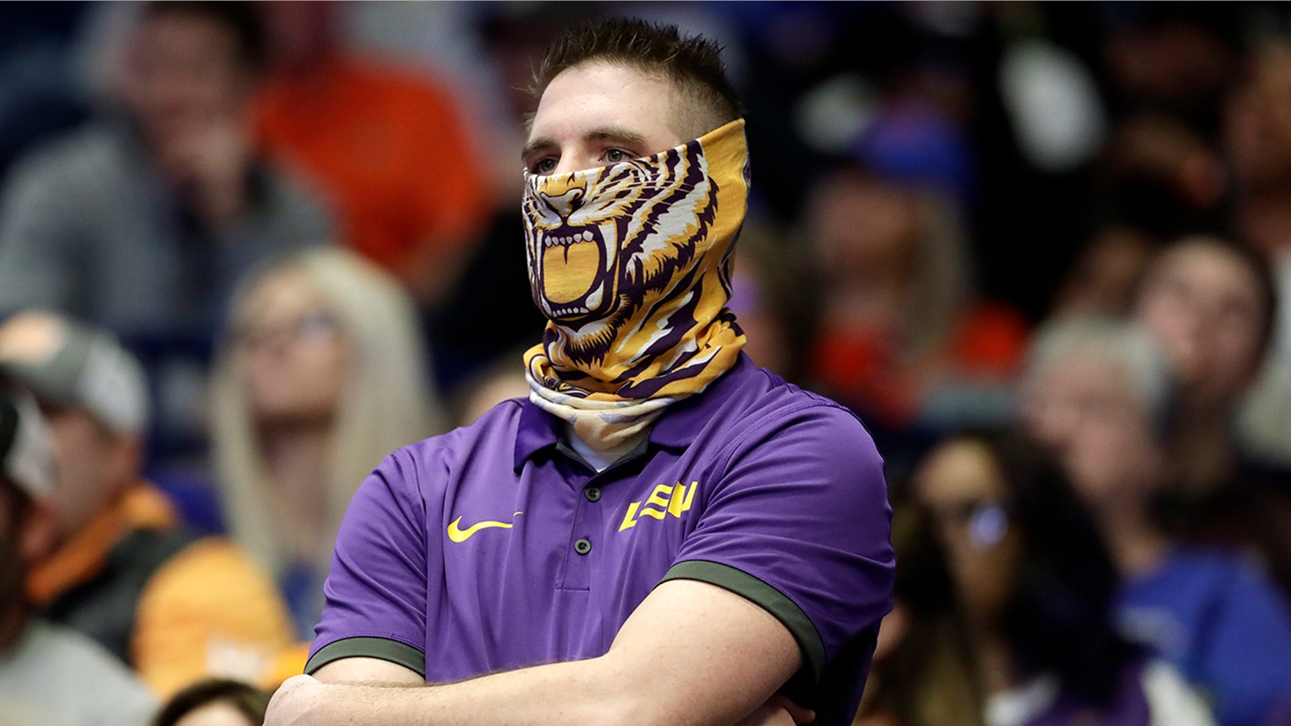 An LSU fan watches during the final minutes of LSU's loss to Florida in an NCAA college basketball game at the Southeastern Conference tournament Friday, March 15, 2019, in Nashville, Tenn. Florida won 76-73. (AP Photo/Mark Humphrey)