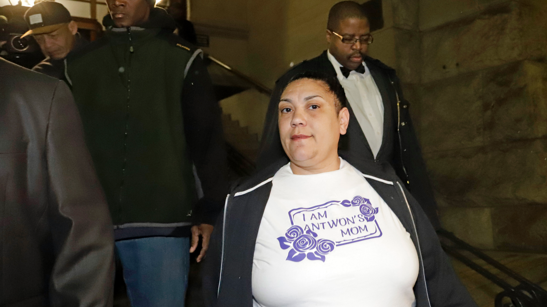 File-This March 22, 2019, file photo shows Michelle Kenney, center, the mother of Antwon Rose II, leaving the Allegheny County Courthouse with supporters after hearing the verdict of not guilty on all charges for Michael Rosfeld, a former police officer in East Pittsburgh, Pa. Kenney joined friends of supporters at a vigil Sunday, March 24, 2019, at the basketball court in the Hawkins Village housing complex in Rankin, where she lives. “This was definitely his spot right here,” Kenney said. “If you was looking for Antwon, you’d find him on the basketball court.” Supporters, she said, put the event together while she was sleeping.
(AP Photo/Gene J. Puskar/File)