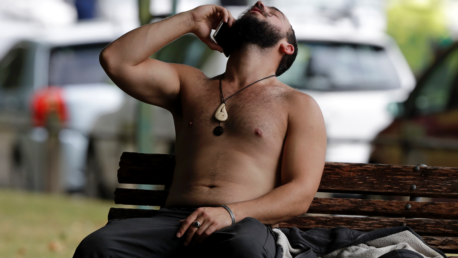 A man reacts as he speaks on a mobile phone outside a mosque in central Christchurch, New Zealand, Friday, March 15, 2019. A witness says many people have been killed in a mass shooting at a mosque in the New Zealand city of Christchurch.(AP Photo/Mark Baker)
