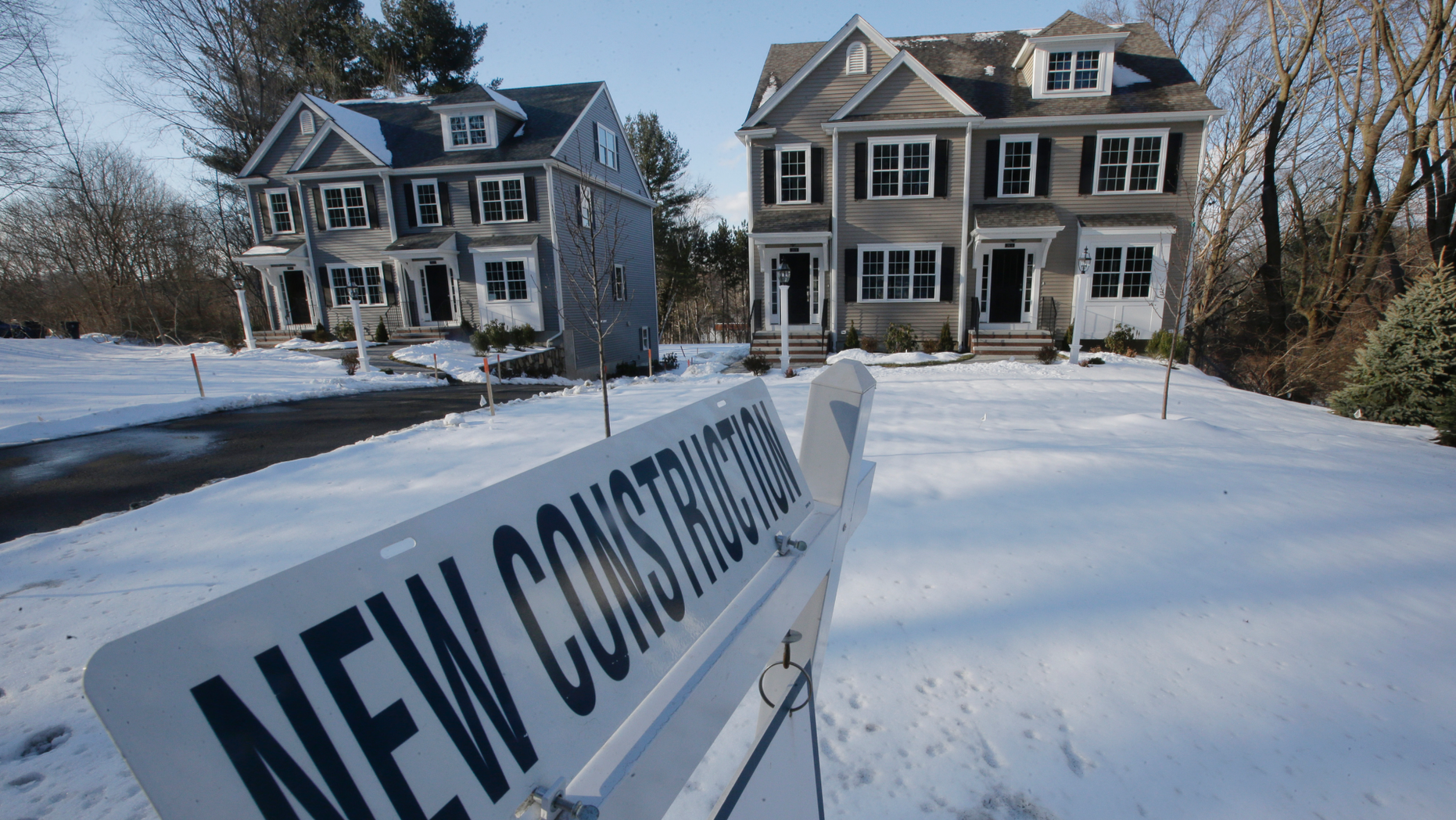 In the photo of Thursday, February 21, 2019, newly built homes are placed near a sign in Natick, Massachusetts. On Friday, March 8, the Commerce Department reported on the construction of homes in the United States in January (AP Photo / Steven Senne).