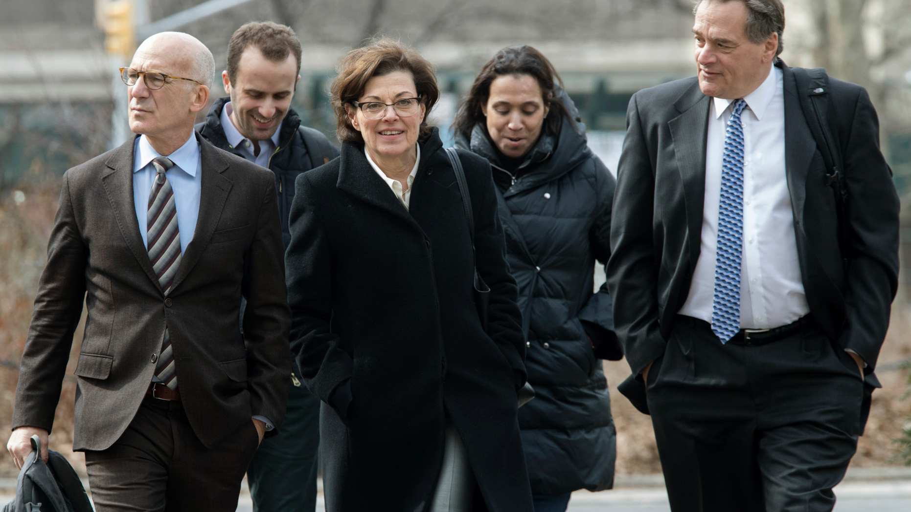 Nancy Salzman, center, arrives at Brooklyn federal court on Wednesday.