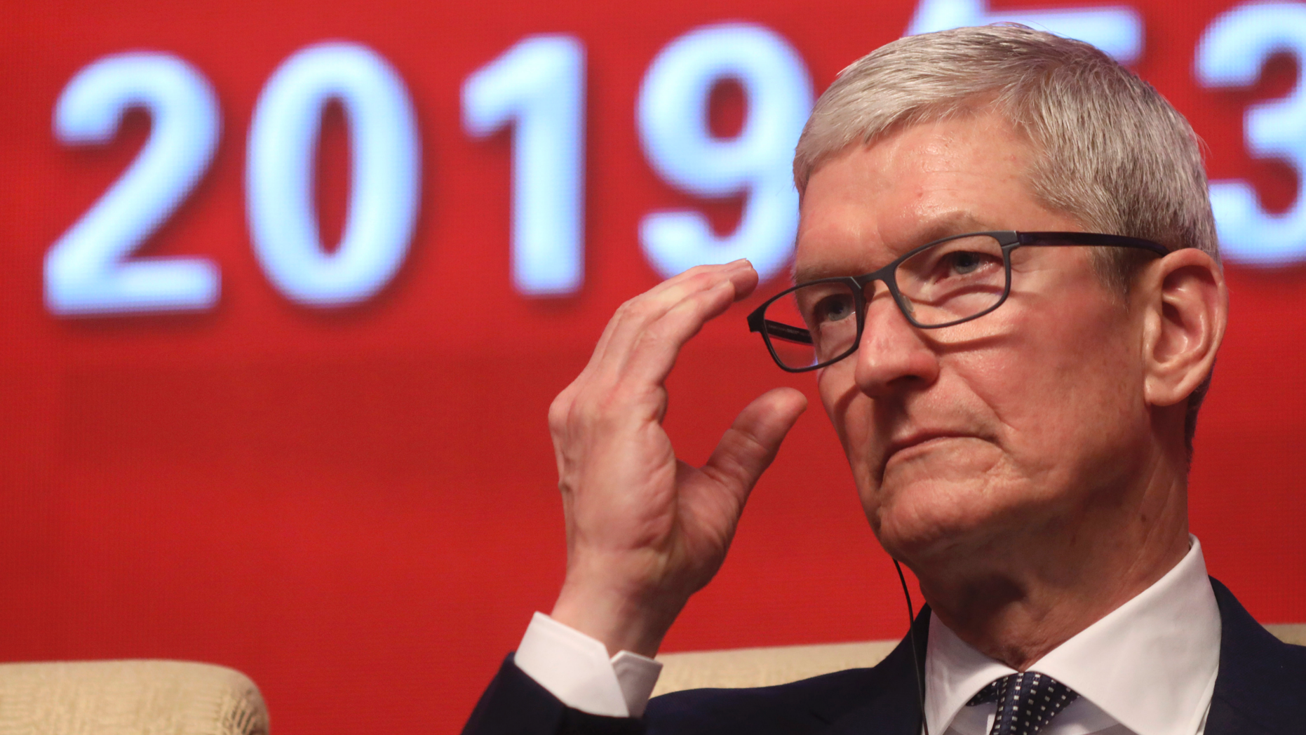 Apple CEO Tim Cook reacts during the Economic Summit held for the China Development Forum in Beijing, China, Saturday, March 23, 2019. Cook says he's