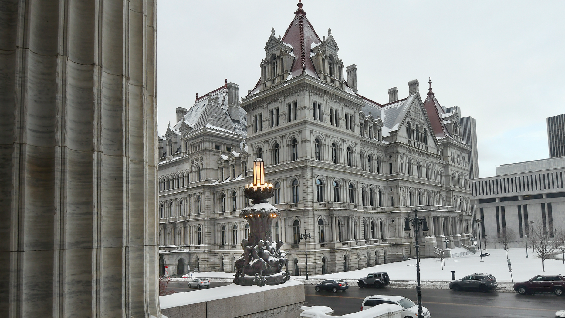 FILE - This Feb. 13, 2019 file photo shows the New York state Capitol building as seen from the steps of the New York state Education Department Building, in Albany, N.Y. Though leaders such as Democratic Gov. Andrew Cuomo insist New York has a tough law on sexual harassment, with more changes proposed in the current legislative session, allegations that roiled a 20-employee office in Glens Falls underscore a familiar criticism: Aggressive policies at state agencies aren't of much use if managers don't take action. (AP Photo/Hans Pennink, File)