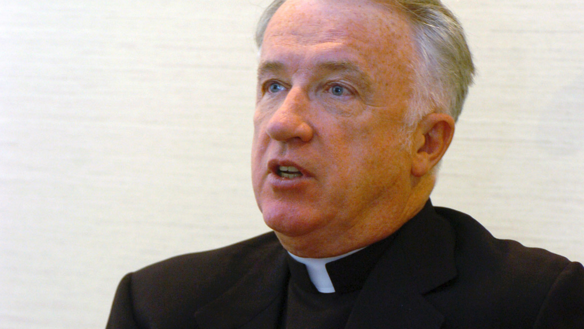 FILE - This Feb. 21, 2005, file photo, shows incoming bishop of the Wheeling-Charleston diocese, W.Va, Michael Bransfield in his new office, in Wheeling, W.Va. The Diocese of Wheeling-Charleston and Bransfield, a former bishop in West Virginia knowingly employed pedophiles and failed to conduct adequate background checks on camp and school workers, a lawsuit filed Tuesday, March 19, 2019 by the state attorney general charges. (AP Photo/Dale Sparks, File)