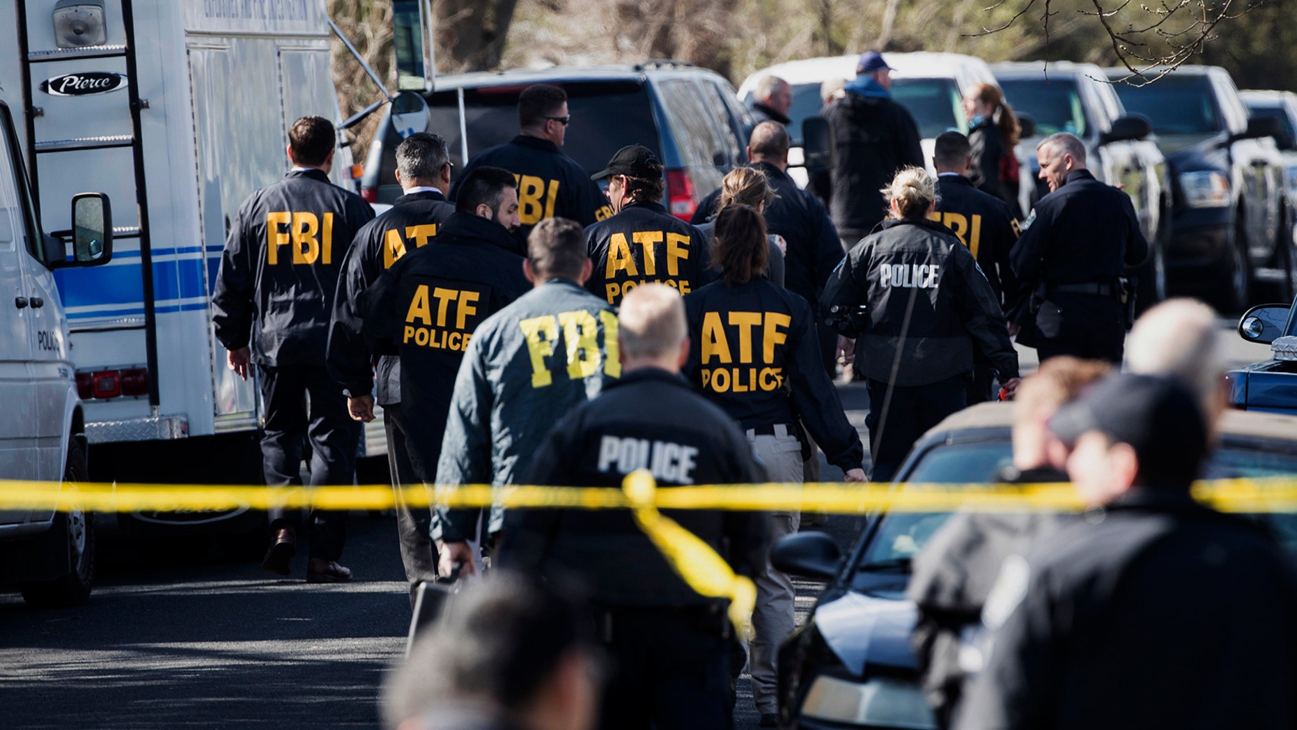 FILE - In this March 12, 2018 file photo, authorities work on the scene of an explosion in Austin, Texas.  Recordings of several 911 calls made after a series of deadly package bombings in Austin last year show the chaos and panic that gripped the city.  (Ricardo B. Brazziell/Austin American-Statesman via AP)