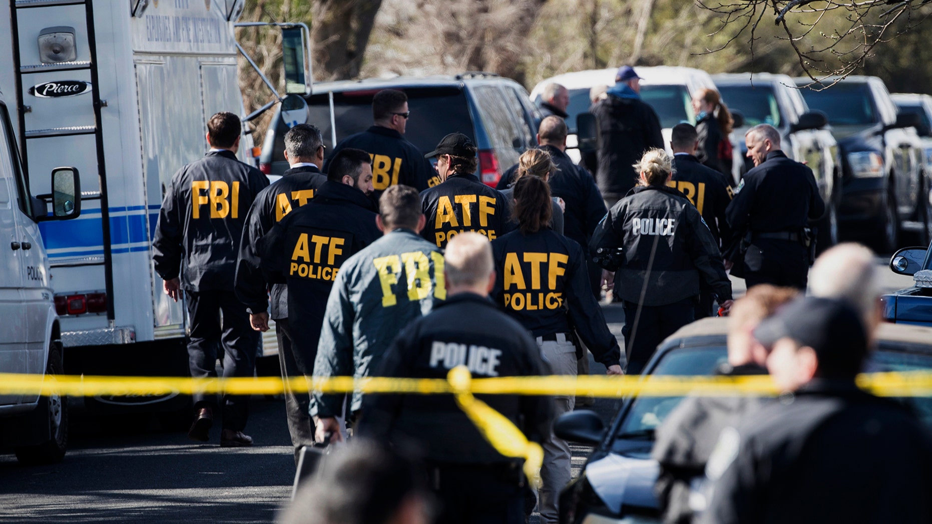 FILE - In this March 12, 2018 file photo, authorities work on the scene of an explosion in Austin, Texas.  Recordings of several 911 calls made after a series of deadly package bombings in Austin last year show the chaos and panic that gripped the city.  (Ricardo B. Brazziell/Austin American-Statesman via AP)