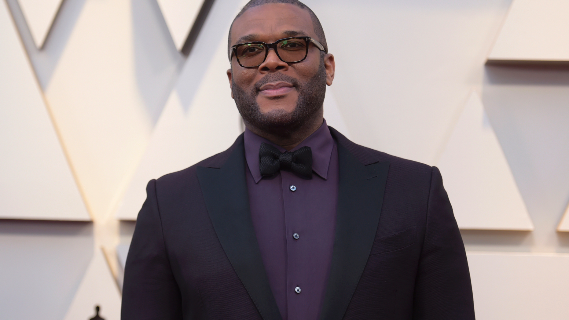FILE - In this Feb. 24, 2019 file photo, Tyler Perry arrives at the Oscars at the Dolby Theatre in Los Angeles. Less than a day after the family of a slain single mother of four launched a fundraising appeal, Perry has lent his support. News outlets report Perry offered to take care of the family’s rent to stave off eviction, arrange for 45-year-old Tynesha Evans’ body to be flown to Wisconsin for burial and cover her 18-year-old daughter’s tuition at Spelman College so she doesn’t have to drop out.(Photo by Richard Shotwell/Invision/AP, File)