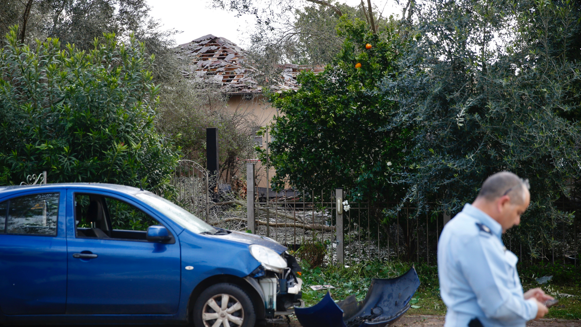 Damage to a house hit by a rocket is seen in Mishmeret, central Israel, Monday, March 25, 2019. An early morning rocket from the Gaza Strip struck a house in central Israel on Monday, wounding several people, an Israeli rescue service said, in an eruption of violence that could set off another round of violence shortly before the Israeli election. (AP Photo/Ariel Schalit)