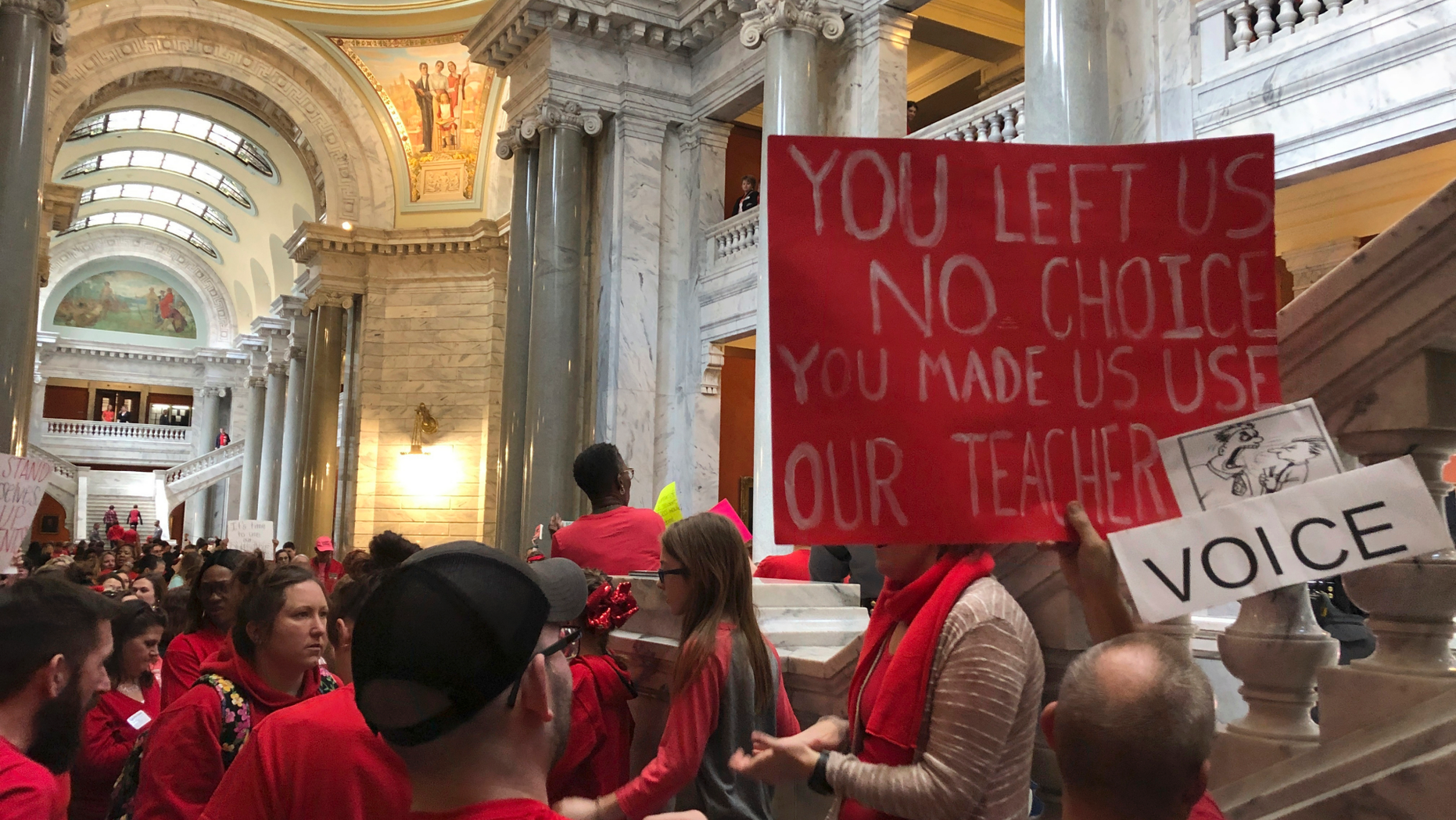 Teachers and public education supporters fill the Kentucky Capitol on Wednesday, March 13, 2019, in Frankfort, Kentucky. Jefferson County Public Schools, the state's largest school district, closed Wednesday for the fifth time in the past two weeks after teachers called in sick so they could come to Frankfort to keep an eye on lawmakers. But one of the proposals teachers were most concerned about, which would have indirectly supported private schools with tax credits, was not included in an agreement on a tax bill lawmakers finished on Wednesday. (AP Photo/Adam Beam)
