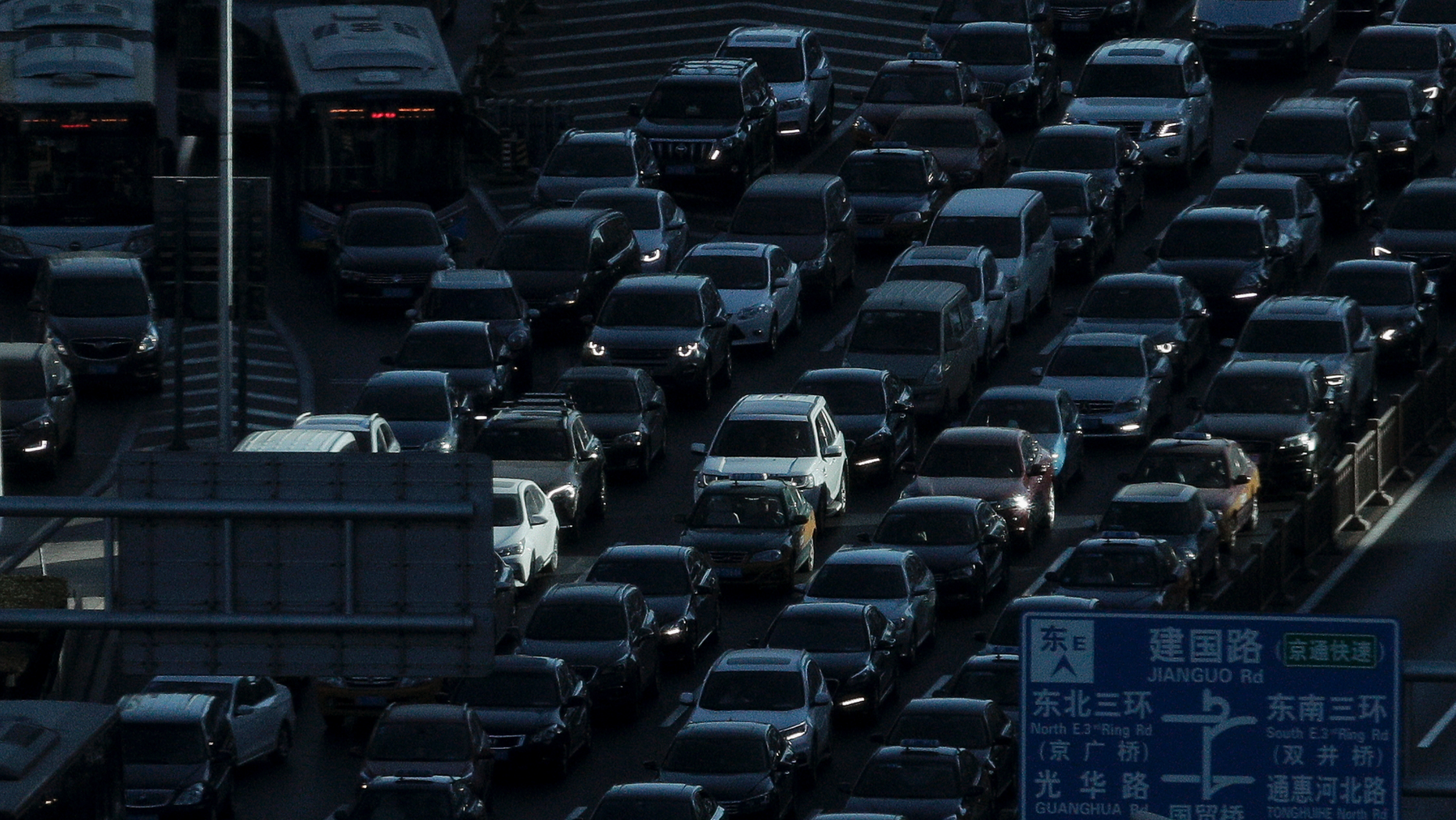 A beam of sunlight is cast on vehicles on a city ring-road clogged with heavy traffic during the morning rush hour in Beijing, Dec. 11, 2018. (Associated Press)
