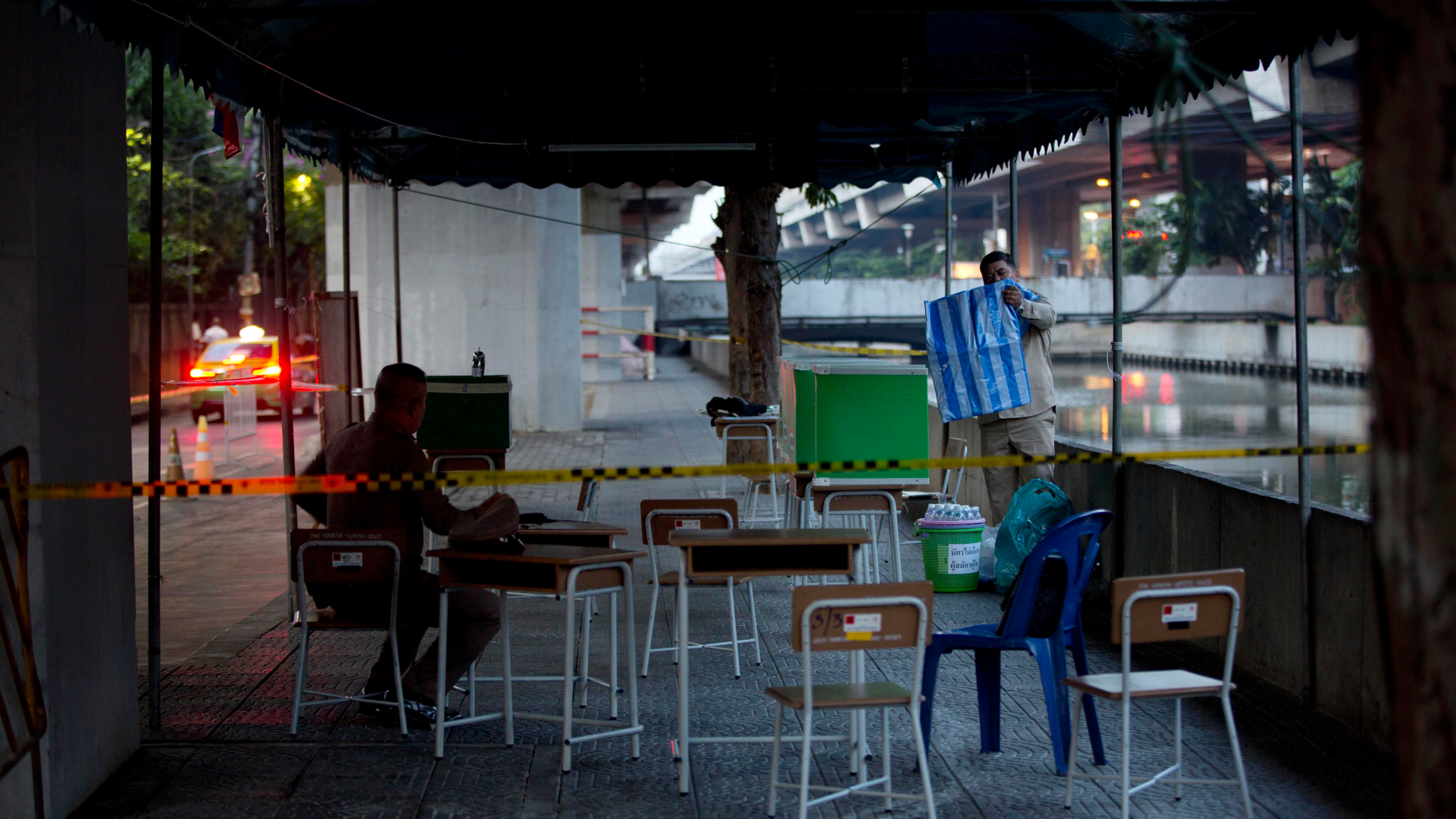 Polling officers set up a polling station where Thailand's Prime Minister Prayuth Chan-ocha is scheduled to cast his vote in Bangkok, Thailand, Sunday, March 24, 2019. Thailand's first general election since the military seized power in a 2014 coup is scheduled to be held on Sunday. (AP Photo/Gemunu Amarasinghe)