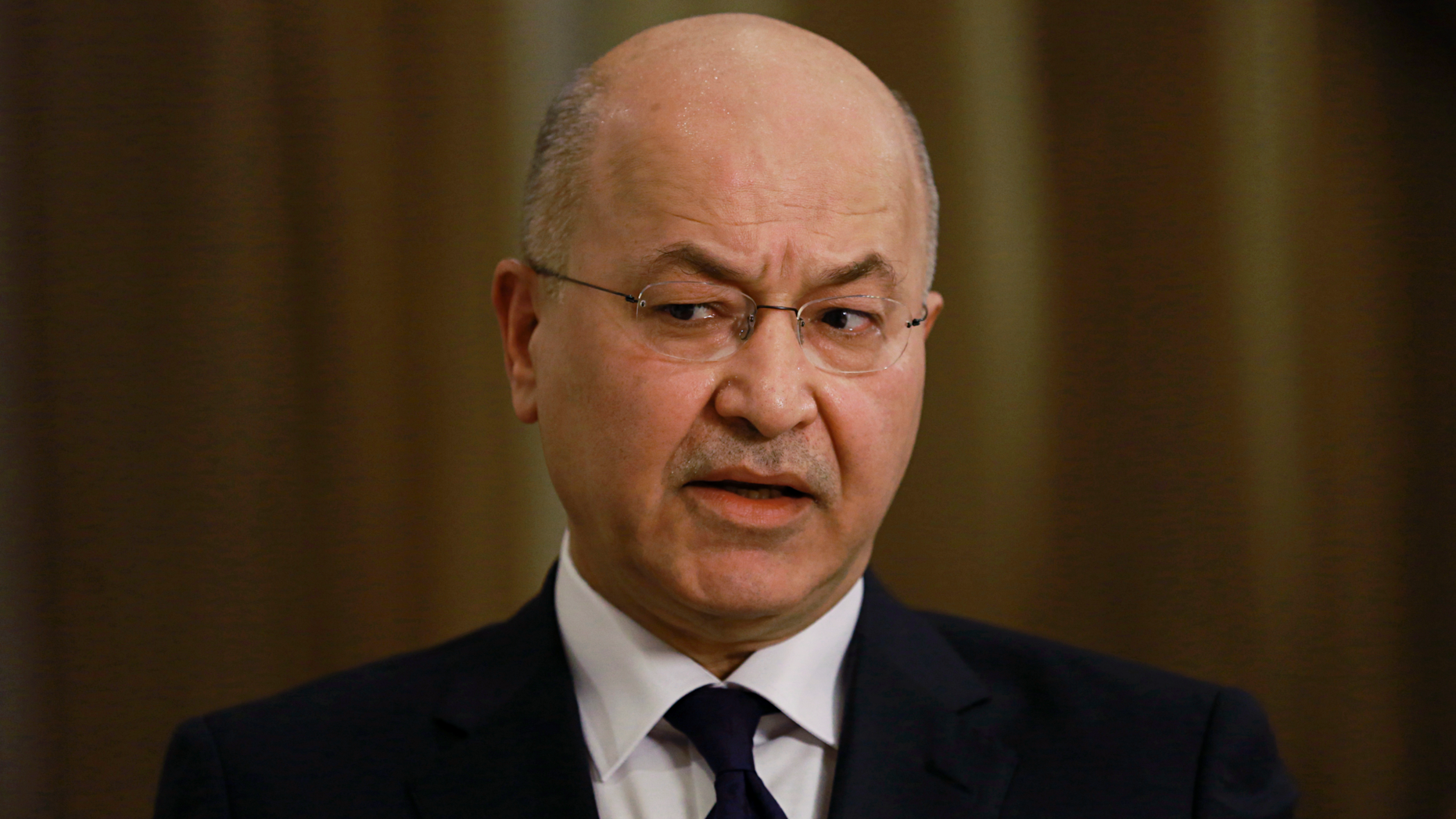 Iraq's President Barham Salih speaks during an interview with The Associated Press in Baghdad, Iraq, Friday, March 29, 2019. Salih says he does not see any "serious" opposition when it comes to the presence of American forces in Iraq as long as they are there for the specific mission of assisting in the fight against the Islamic State group. (AP Photo/Khalid Mohammed)