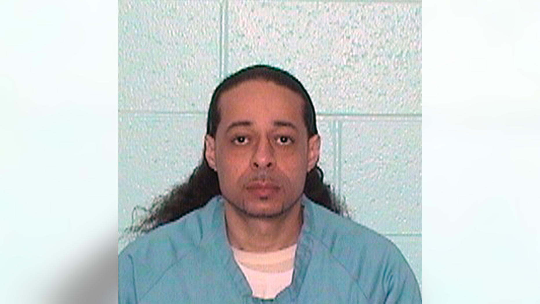 FILE--This undated booking file photo released by Illinois Department of Corrections shows Floyd E. Brown. Brown has pleaded not guilty in a federal case accusing him of fatally shooting a sheriff's deputy who was trying to serve an arrest warrant at a hotel. Brown of Springfield appeared in Rockford federal court Wednesday, March 20, 2019 sitting in a wheelchair and wearing green jail scrubs. A grand jury Tuesday indicted him on murder and weapons charges.(Illinois Department of Corrections via AP,File)
