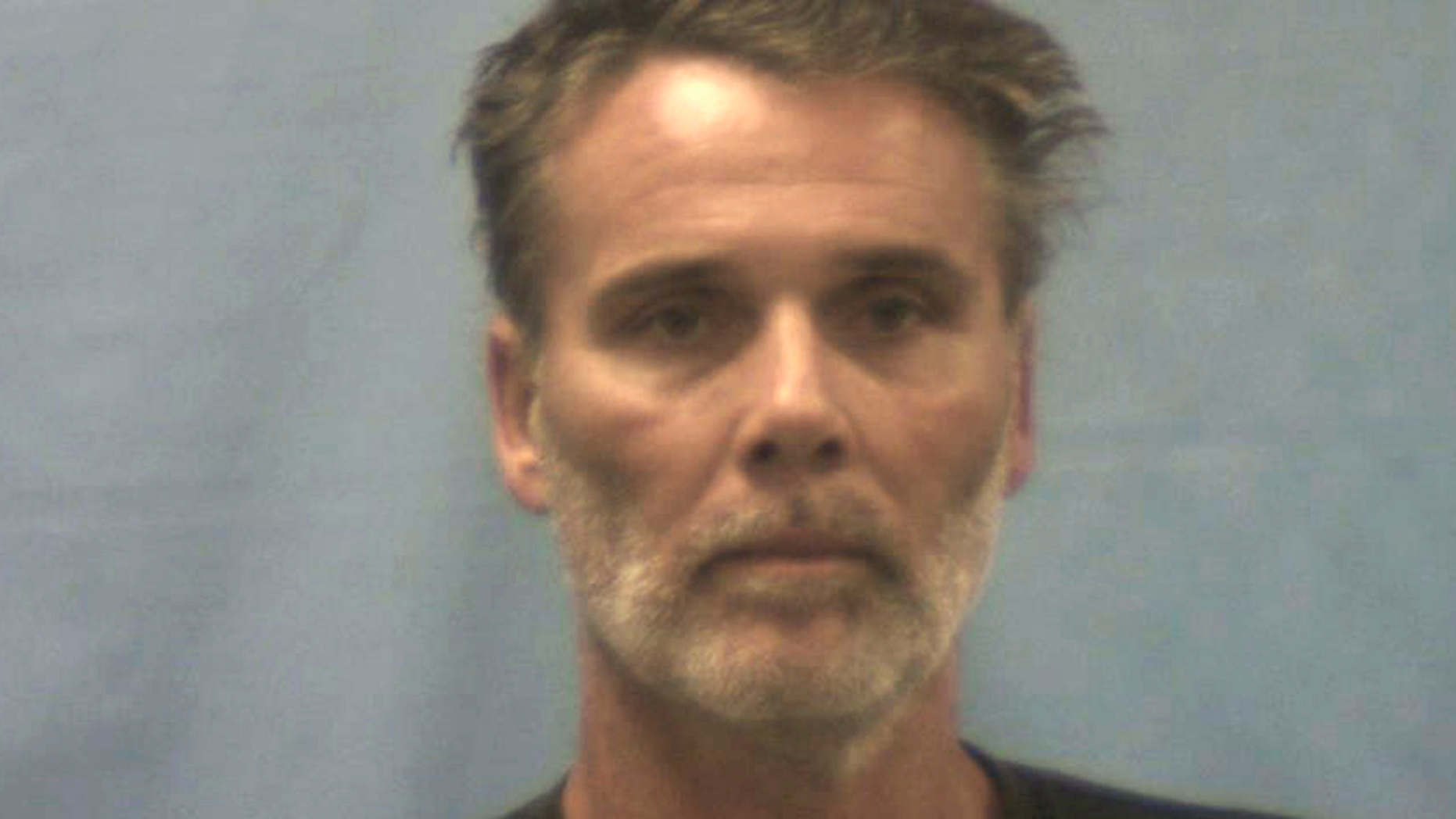 FILE - This undated file photo provided by the Crawford County Jail in Van Buren, Ark., shows Michael Fowler Jr. One of several people charged in the deaths of a couple who disappeared from a Kansas county fair has pleaded guilty. The Great Bend Tribune reports Fowler Jr., of Sarasota, Fla., pleaded guilty to first-degree murder and theft. Alfred "Sonny" Carpenter and Pauline Carpenter of Wichita were found dead in July in shallow graves in Arkansas. Investigators say one suspect posed as a carnival mafia boss and ordered the other suspects to kill the couple (Crawford County Jail via AP, File)