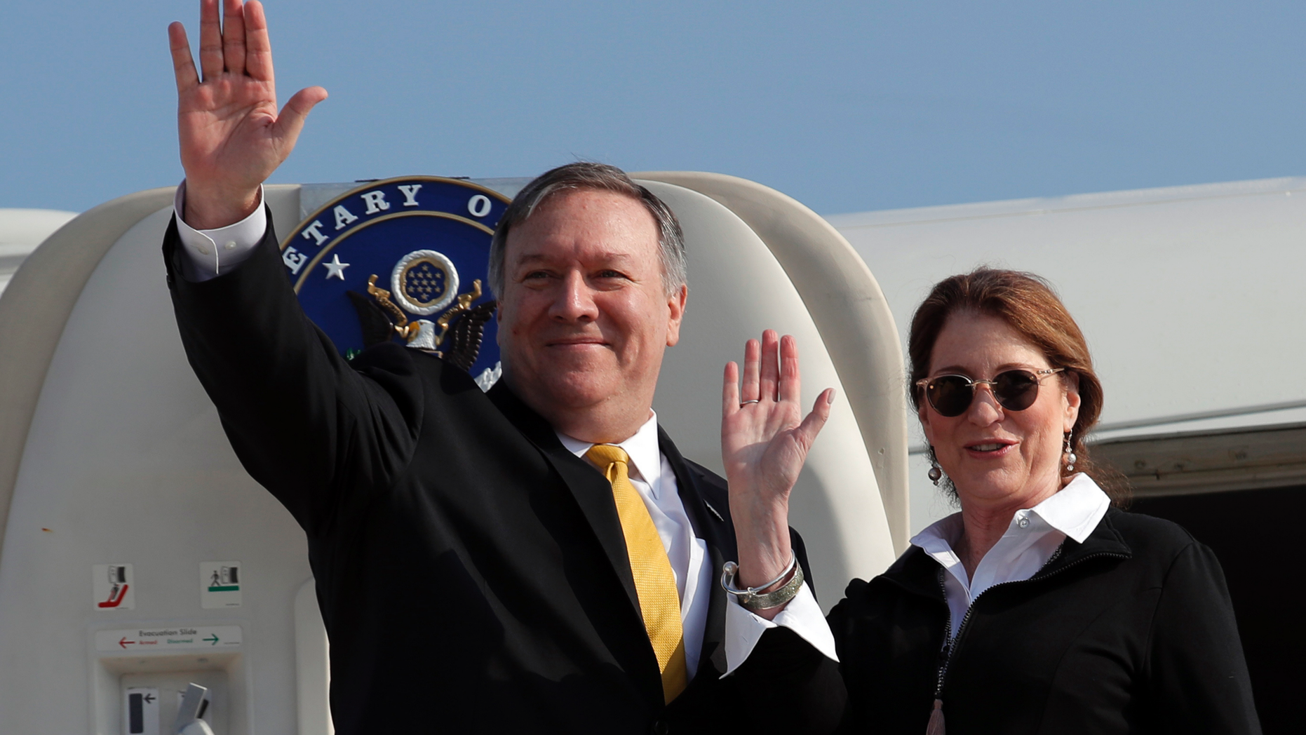 U.S. Secretary of State Mike Pompeo and his wife Susan wave before boarding their airplane to Beirut at Ben Gurion airport near Lod, Israel, Friday, March 22, 2019. (Jim Young/Pool Photo via AP)