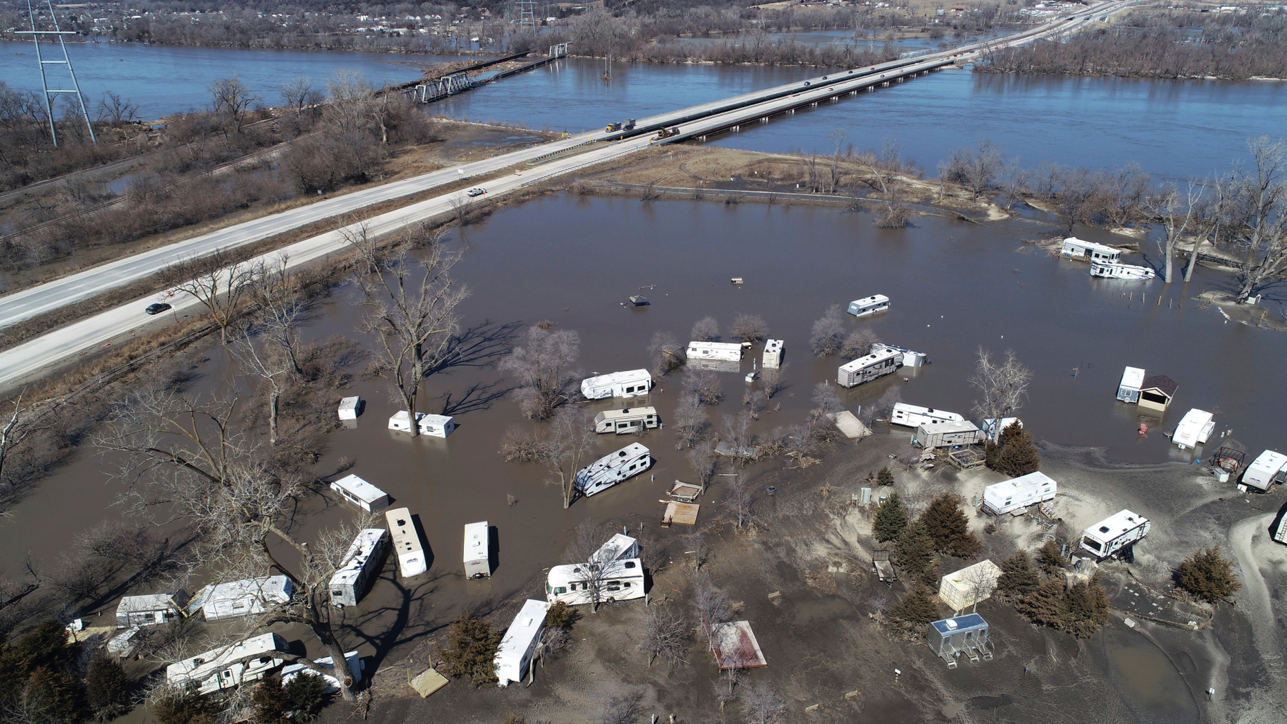 This Wednesday, March 20, 2019 aerial photo shows flooding near the Platte River in in Plattsmouth, Neb., south of Omaha. The National Weather Service is warning that flooding in parts of South Dakota and northern Iowa could soon reach historic levels. A Weather Service hydrologist says "major and perhaps historic" flooding is possible later this month at some spots on the Big Sioux and James rivers. The worst of the flooding so far has been in Nebraska, southwestern Iowa and northwestern Missouri. (DroneBase via AP)