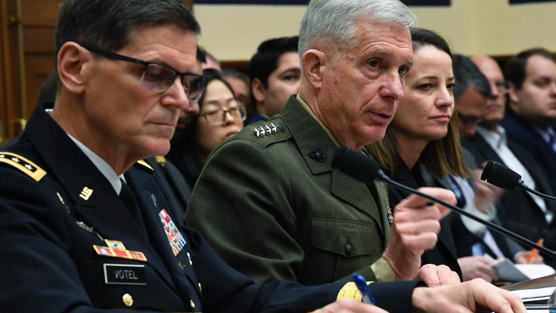 U.S. Africa Command Commander Gen. Thomas Waldhauser, center, flanked by U.S. Central Command Commander Gen. Joseph Votel, left, and Acting Assistant Secretary of Defense for International Security Affairs Kathryn Wheelbarger, right, testifies before the House Armed Services Committee on Capitol Hill in Washington, Thursday, March 7, 2019. (AP Photo/Susan Walsh)
