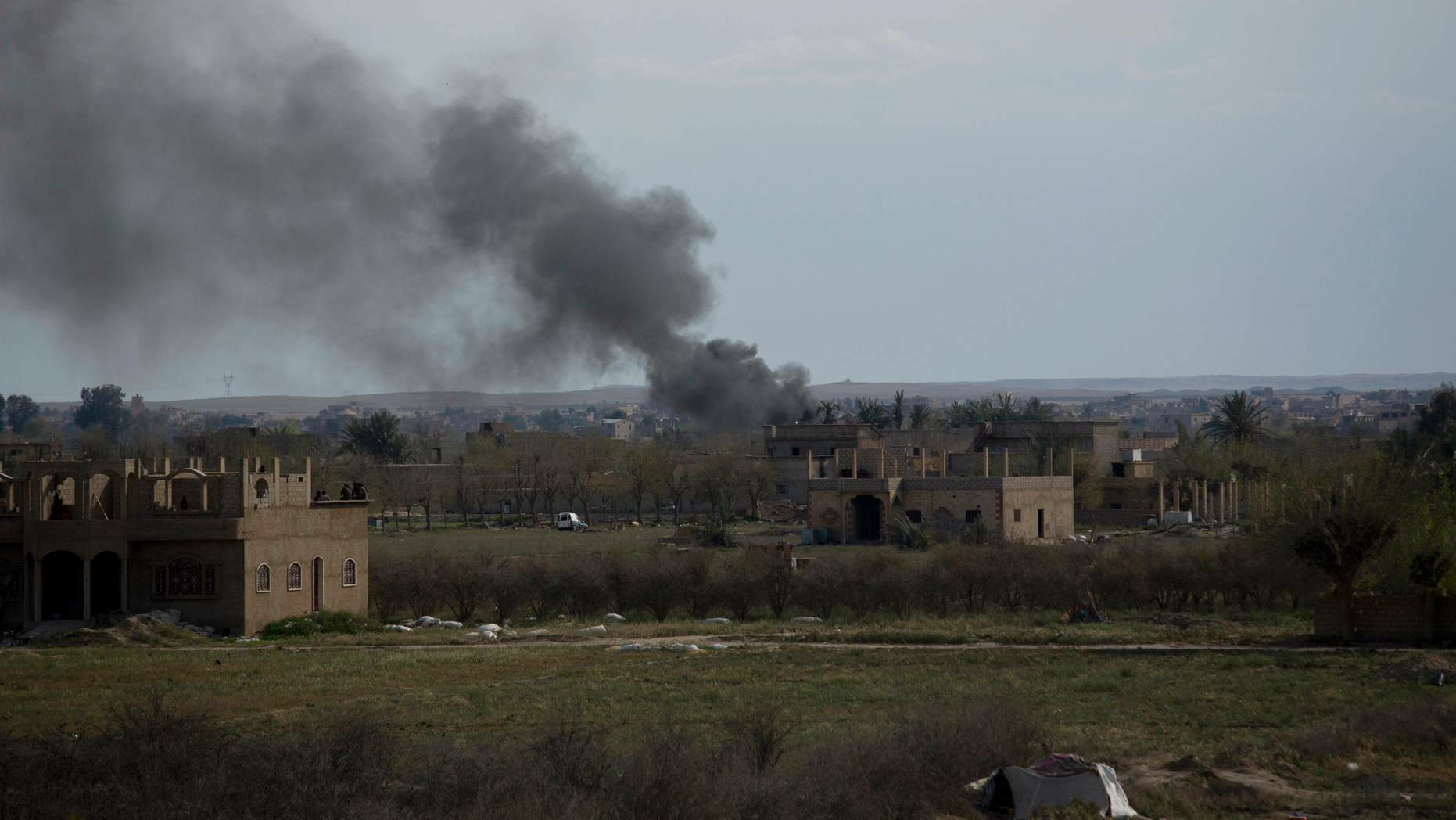 Smoke rises from a strike on Baghouz, Syria, on the Islamic State group's last piece of territory on Friday, March 22, 2019. (AP Photo/Maya Alleruzzo)
